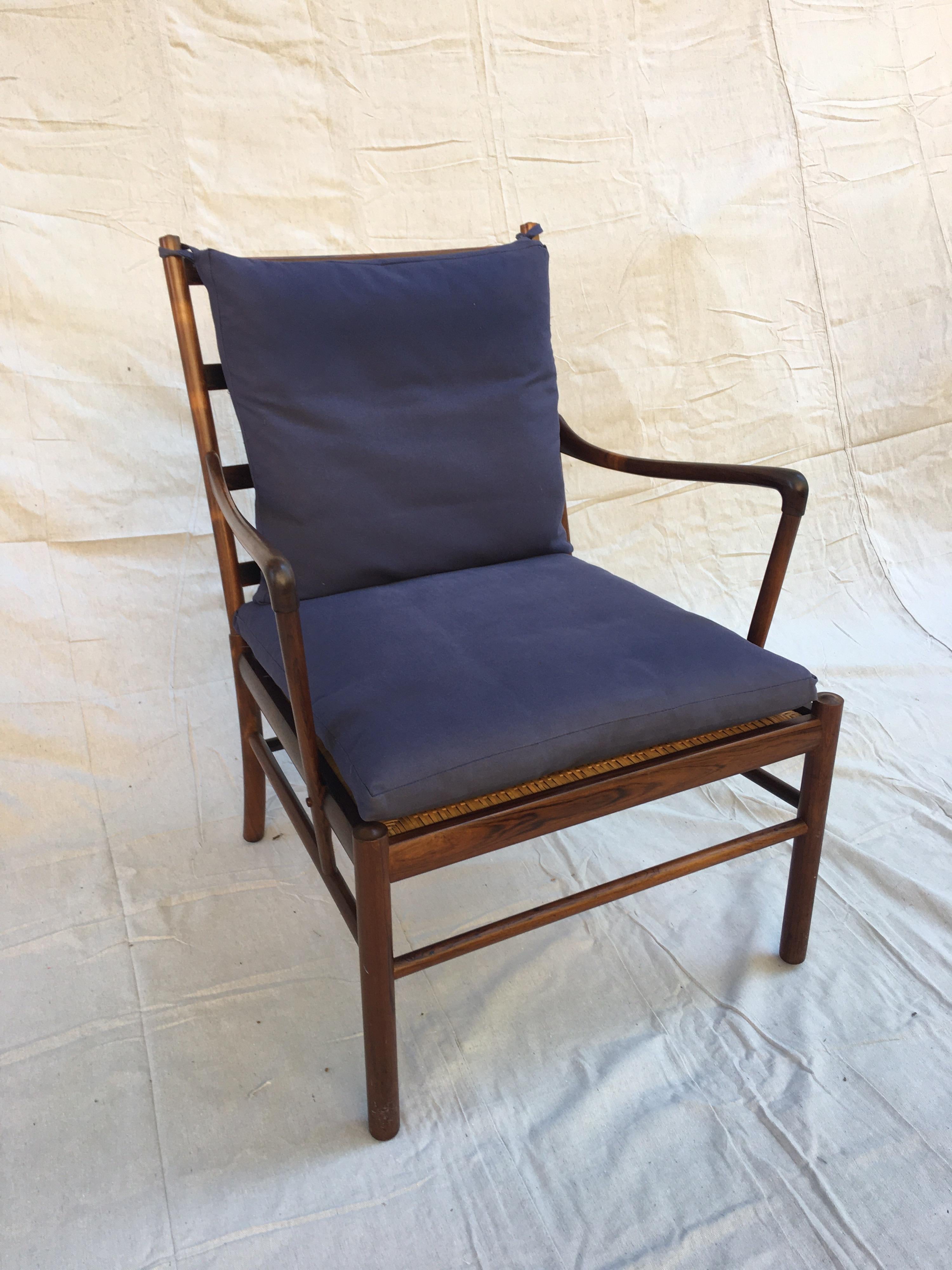 Ole Wanscher colonial chair in rosewood. Beautiful chair, beautiful wood! Grain in amazing, color is rich with no fading! Original caned seat panel. Looks like the cushions were redone at some point in their life. Solid construction, ready to go!