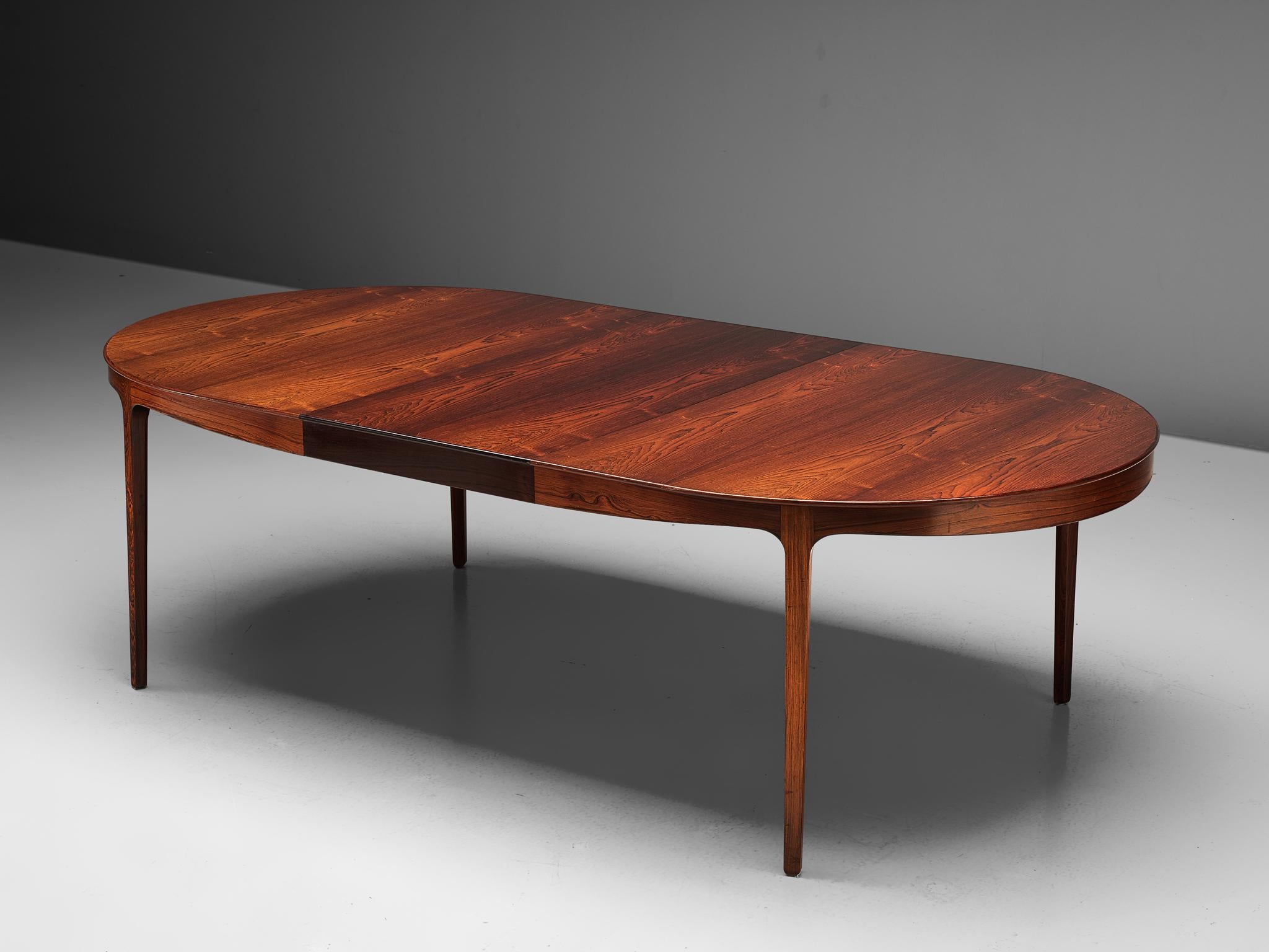 Ole Wanscher for AJ Iversen, dining table, rosewood and, Denmark, 1963.

A luxurious dining table in rosewood. The oval shaped dining table comes with two additional leaves, which makes this a highly versatile piece. The grain is of an exceptional