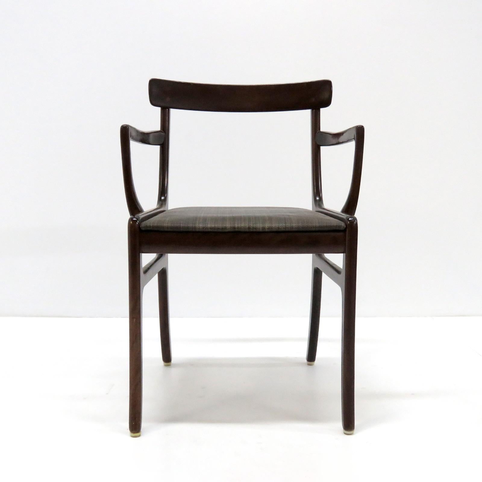 Stunning 1950s pair of organically shaped mahogany dining arm chairs model 'Rungstedlund' by Ole Wanscher for P. Jeppesen, Denmark. The seats are covered in the original very dark brown striped horsehair upholstery, marked with the metal PJ tag. The