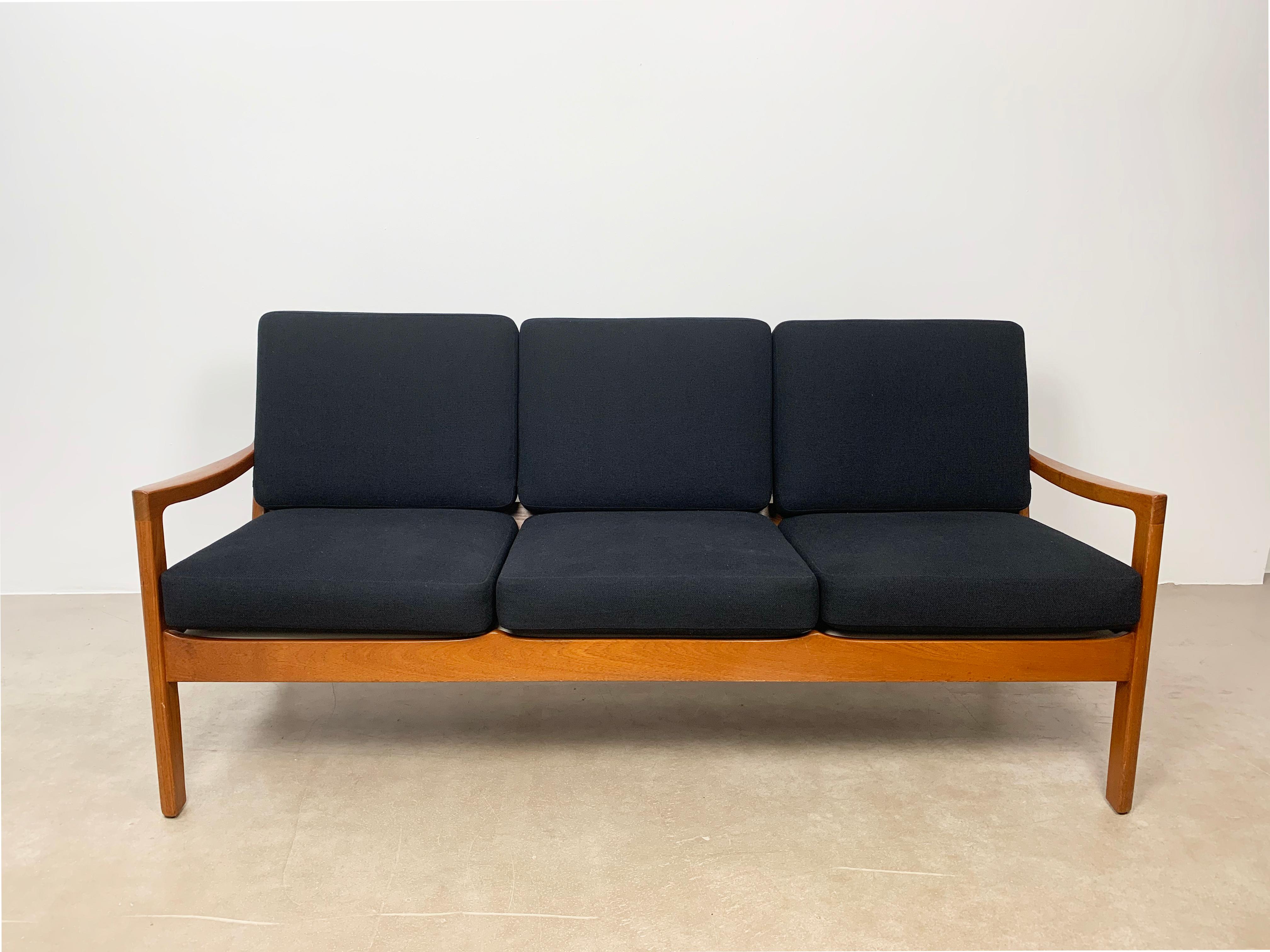 Ole Wanscher sofa Senator in solid teak. Designed in 1962 by Ole Wanscher model Senator Manufactured by France and Son in 1960’s. Newly upholstered.

Born in Copenhagen in 1903 (died 1985), Danish architect-designer Ole Wanscher was a key player