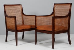 Ole Wanscher set of bergeres in mahogany, cane and patinated leather. 1930's