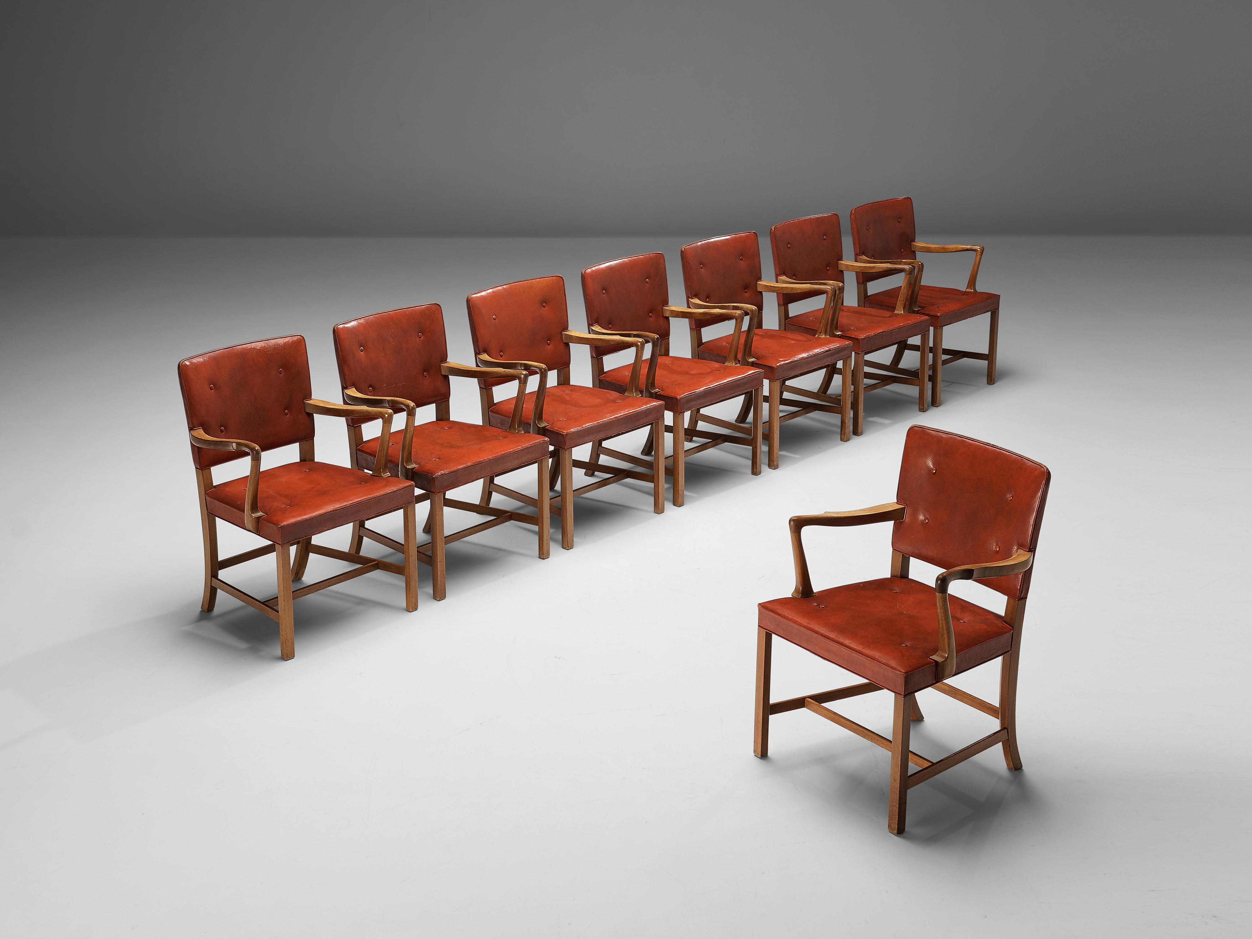 Ole Wanscher for A.J. Iversen, set of eight armchairs, red patinated leather, mahogany, Denmark, circa 1945

Set of eight elegant dining chairs in mahogany, designed by Ole Wanscher and produced by A.J. Iversen. These chairs show a combination of