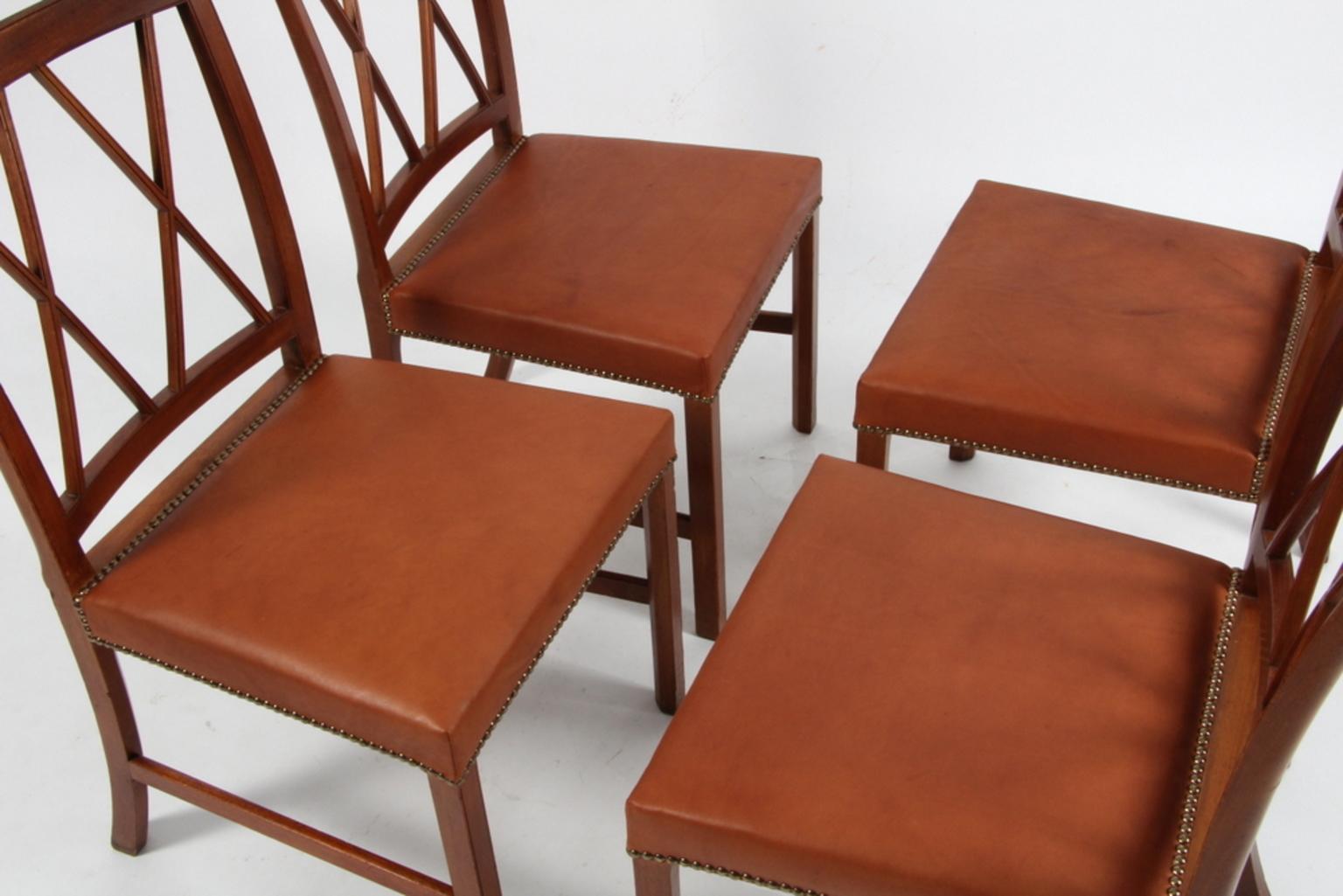 Ole Wanscher set of four dining chairs, new upholstered cognac aniline leather.

Made of mahogany.

Made of A. J. Iversen.