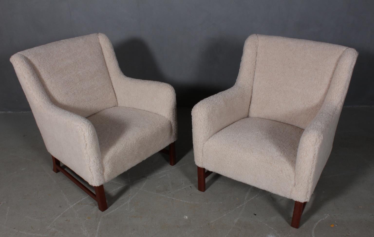 Ole Wanscher set of lounge chairs new upholstered with lambwool.

Legs of mahogany

Made by A. J. Iversen, in the 1950s.
  
     