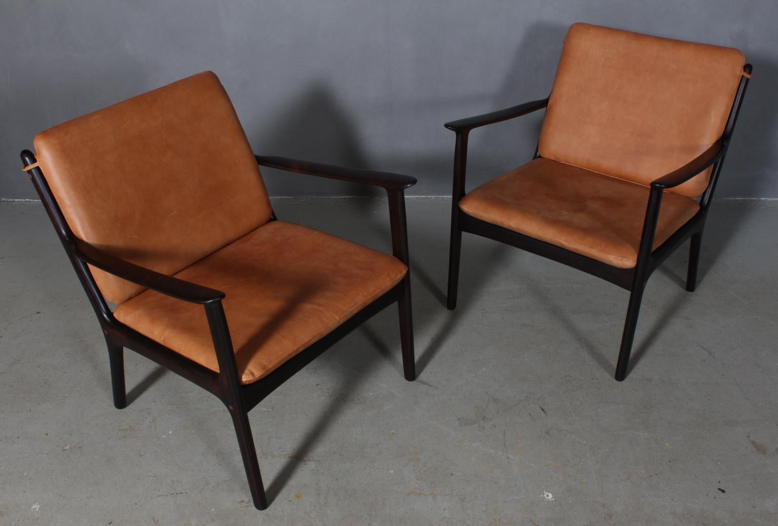 Ole Wanscher set of lounge chairs new upholstered in tan vintage aniline leather. 

Made of solid oiled rosewood.

Model PJ 112, made by Poul Jeppesen.

 