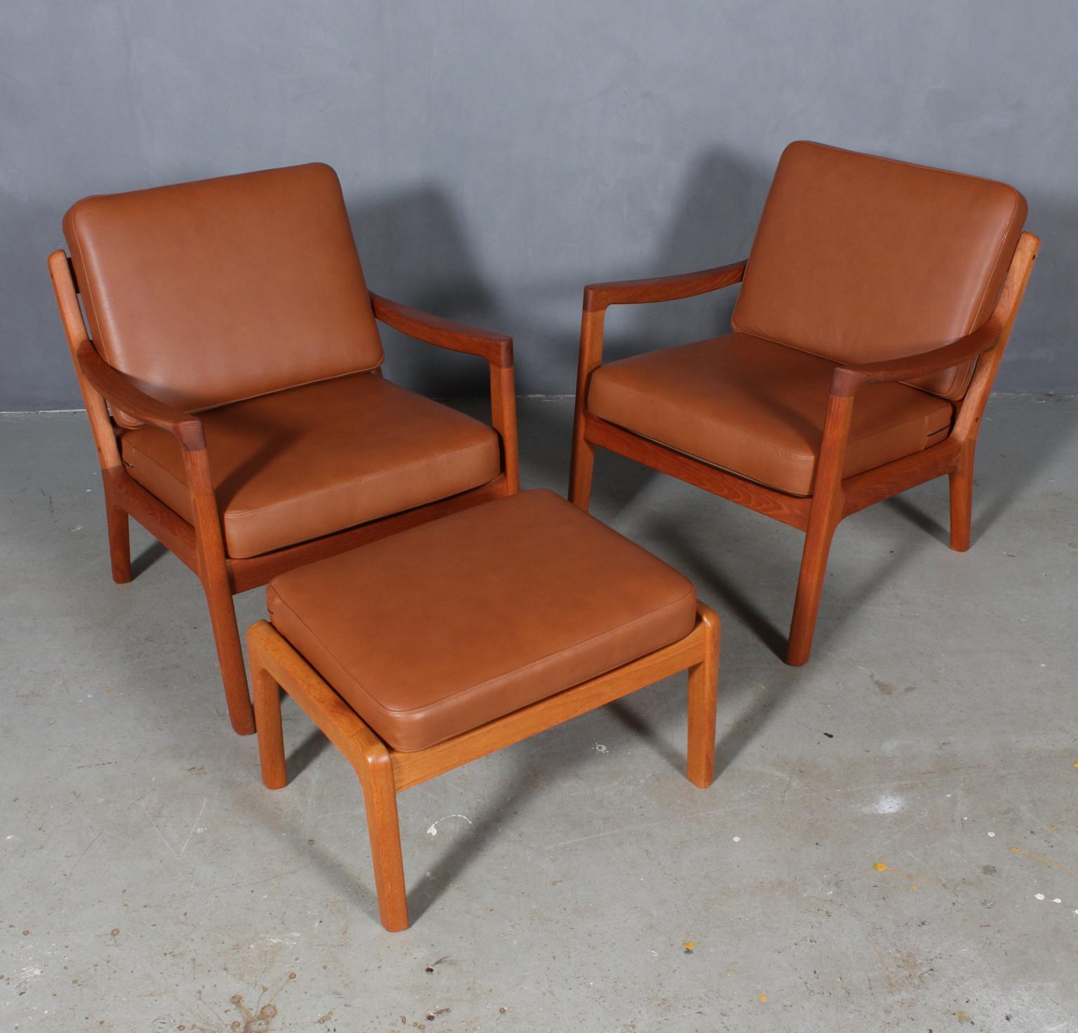 Ole Wanscher set of lounge chairs with ottoman new upholstered with tan aniline leather.

Made of solid teak.

Model senator, made by Cado.