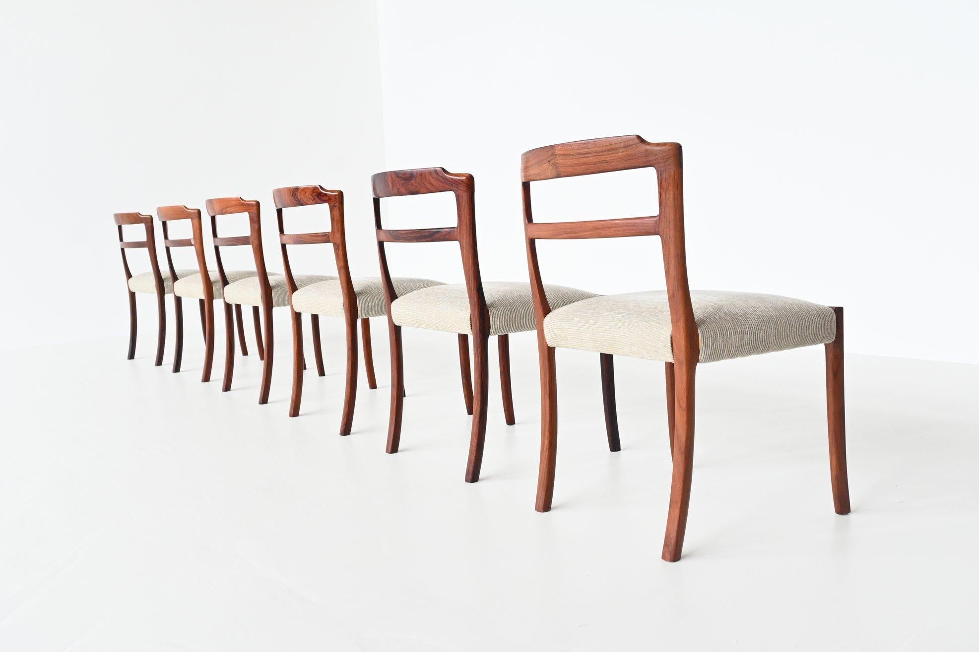 Gorgeous set of six dining chairs designed by Ole Wanscher and manufactured by A.J. Iversen, Denmark 1960. These very nice shaped dining chairs are made of beautiful grained solid rosewood and they are upholstered with cream white ribbed fabric. The