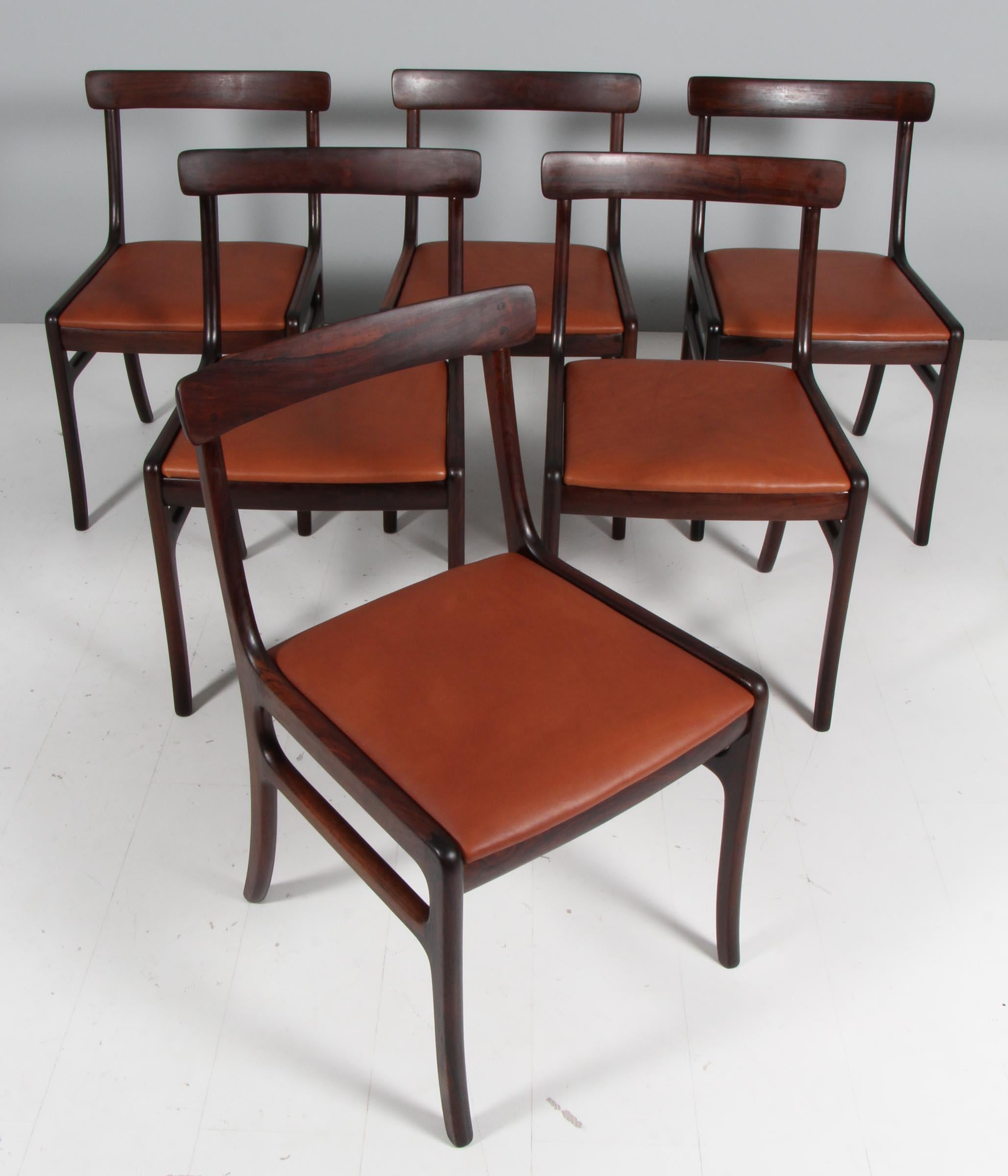 Ole Wanscher set of six Rungstedlun dining chairs in rosewood.

New upholstered with brandy aniline leather.

Model Rungstedlund, made by Poul Jeppesen.

