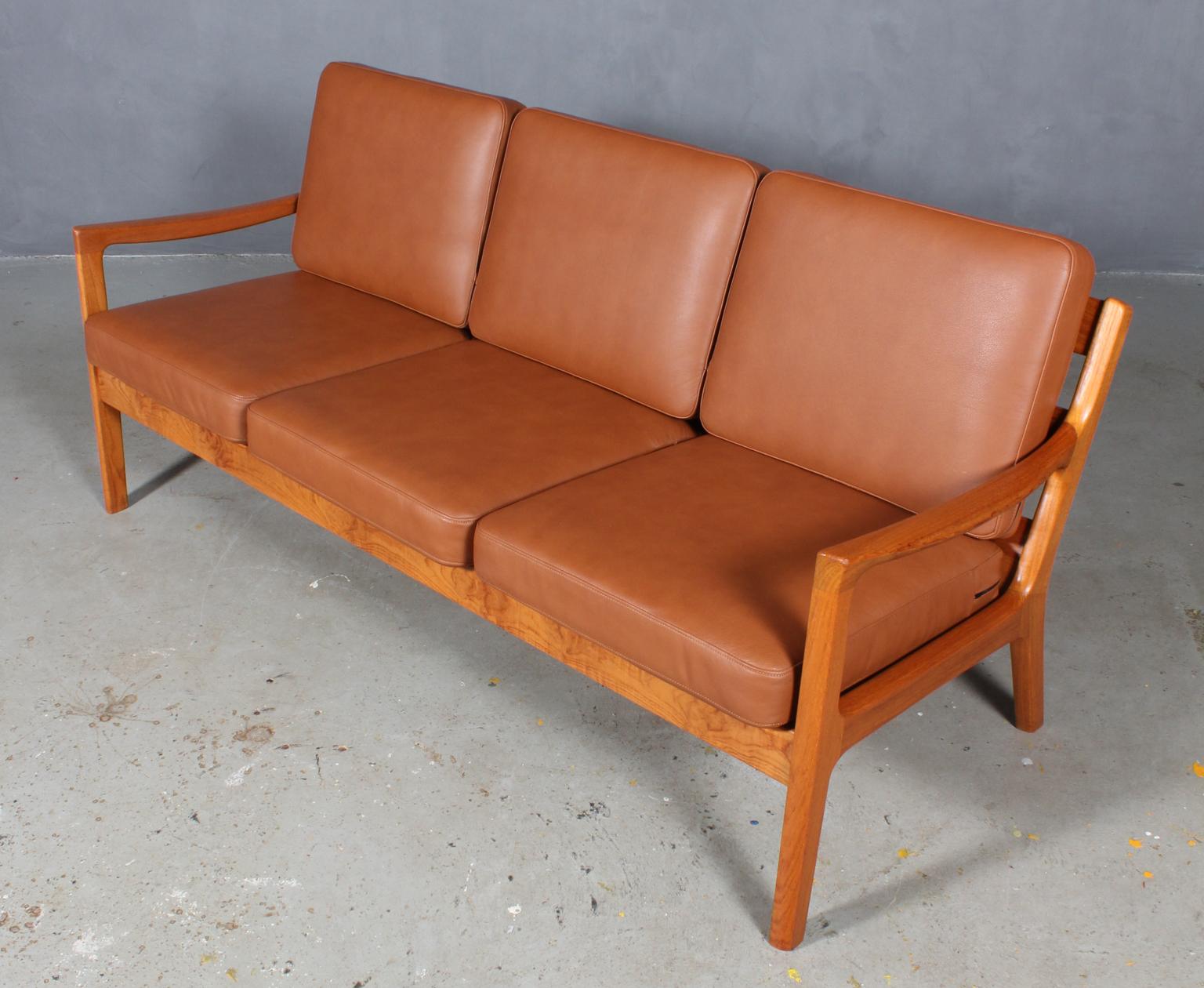 Ole Wanscher three-seat sofa new upholstered with tan aniline leather.

Made of solid teak.

Model senator, made by Cado.