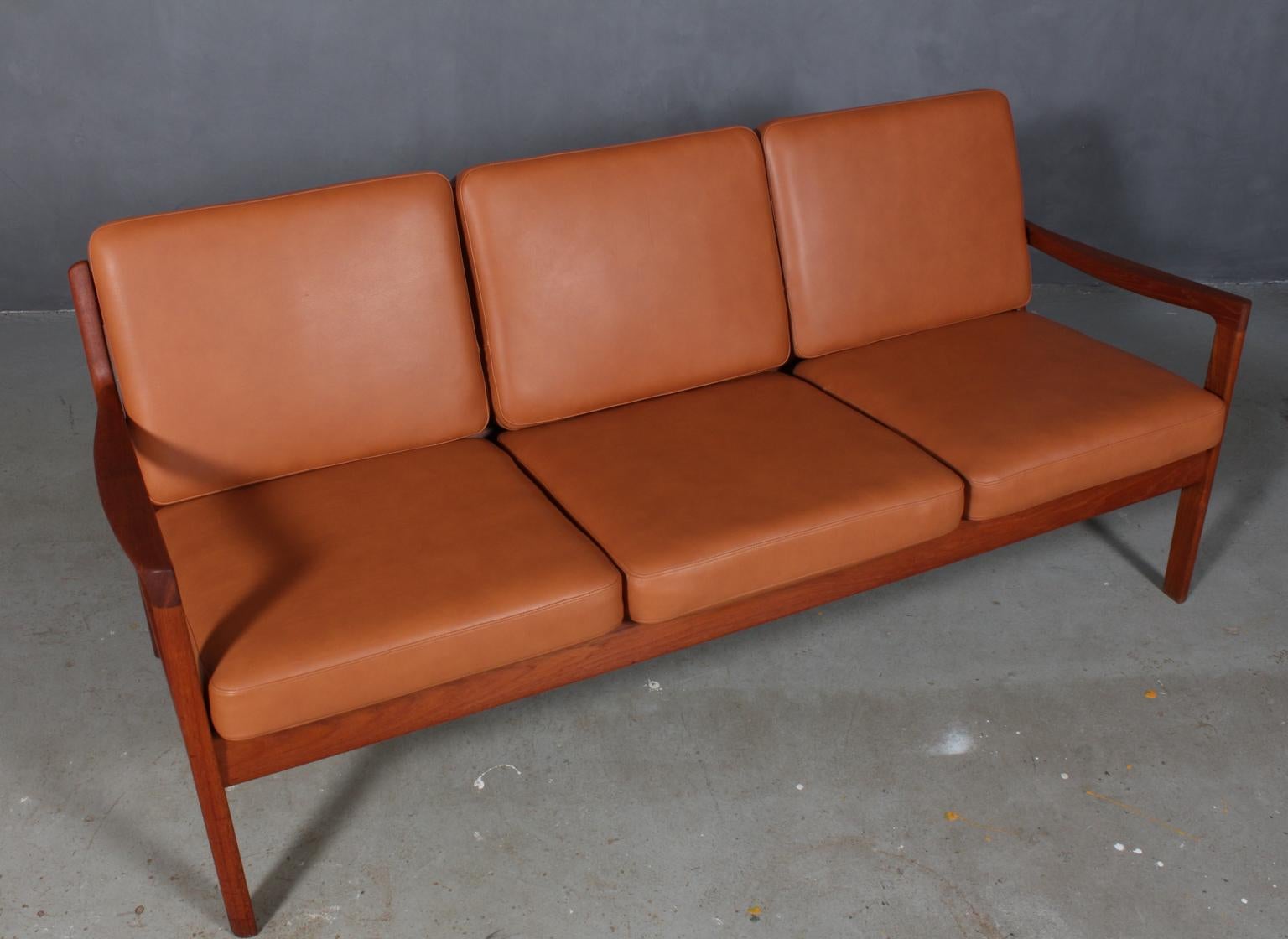 Ole Wanscher three-seater sofa new upholstered with cognac aniline leather.

Made of solid mahogany.

Model Senator, made by France & Son.

 
