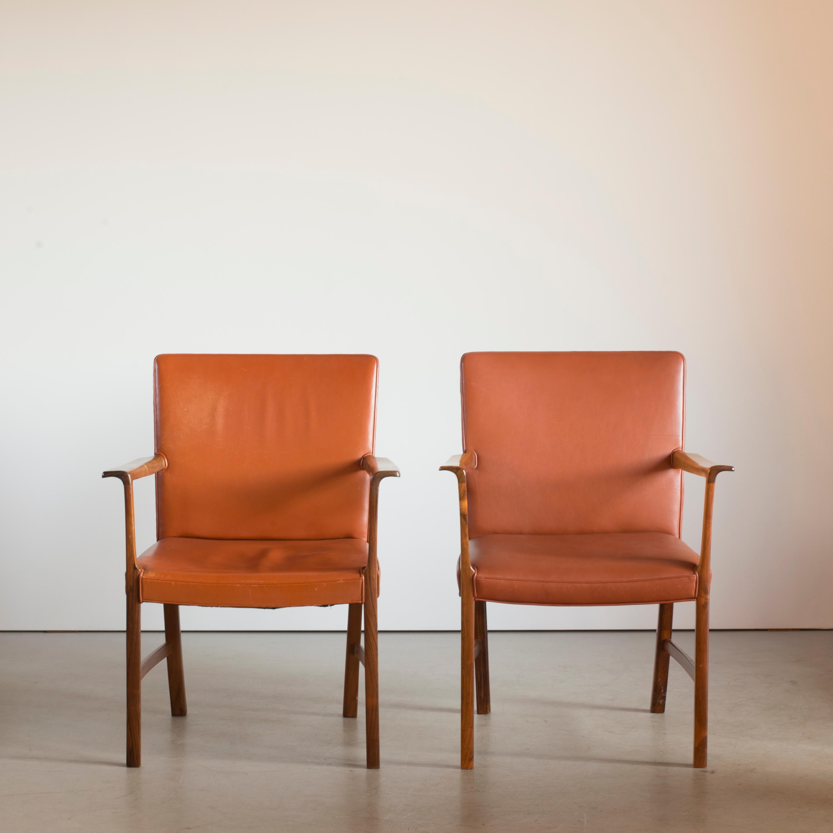 Ole Wanscher two armchairs in rosewood and leather. Executed by A. J. Iversen, Copenhagen, Denmark.