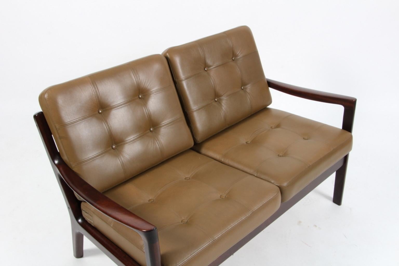 Ole Wanscher two-seat sofa upholstered with original green leather.

Made of solid mahogany.

Model Senator, made by Cado.

 