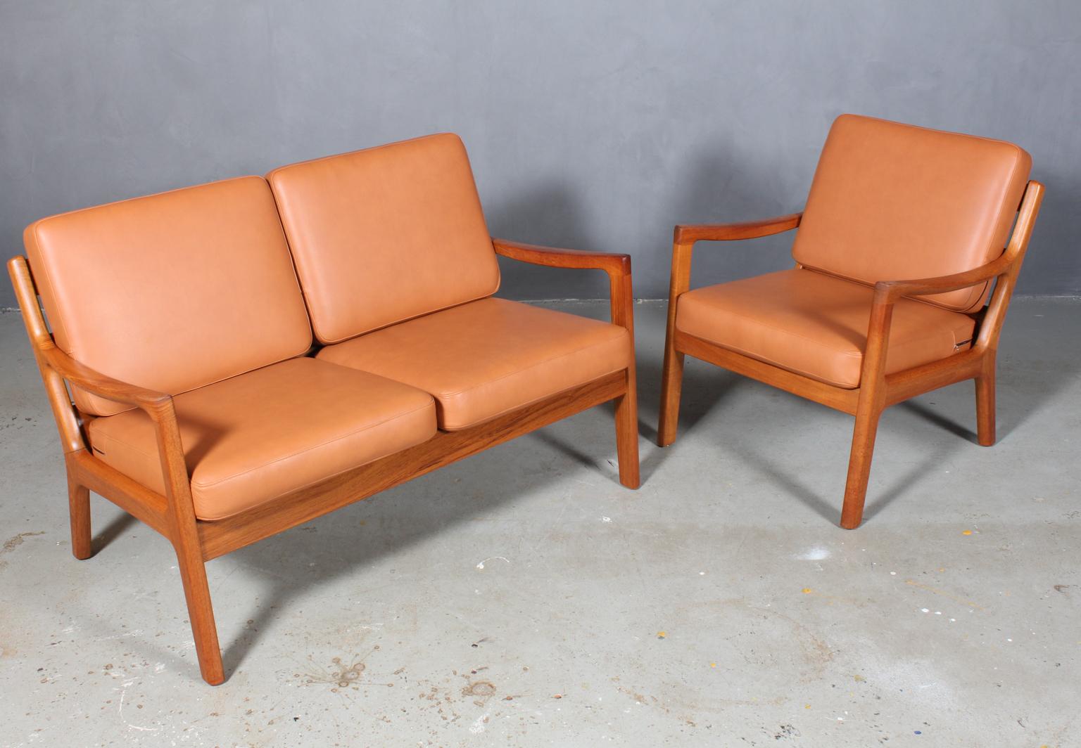 Ole Wanscher two-seat sofa and lounge chair new upholstered with cognac aniline leather.

Made of solid teak.

Model Senator, made by France & Son.

  