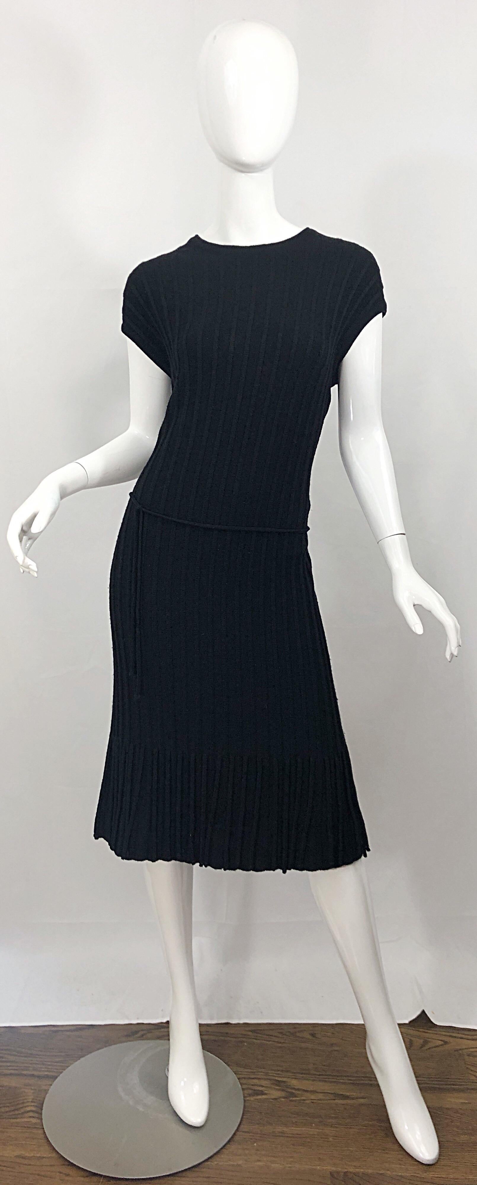 Fantastic vintage 60s OLEG CASSINI black virgin wool larger size Italian made carwash hem dress! Photos do not do this rare beauty justice. Features wool fringe along the entire hem on the front and back. Detachable wool belt ties to adjust to waist