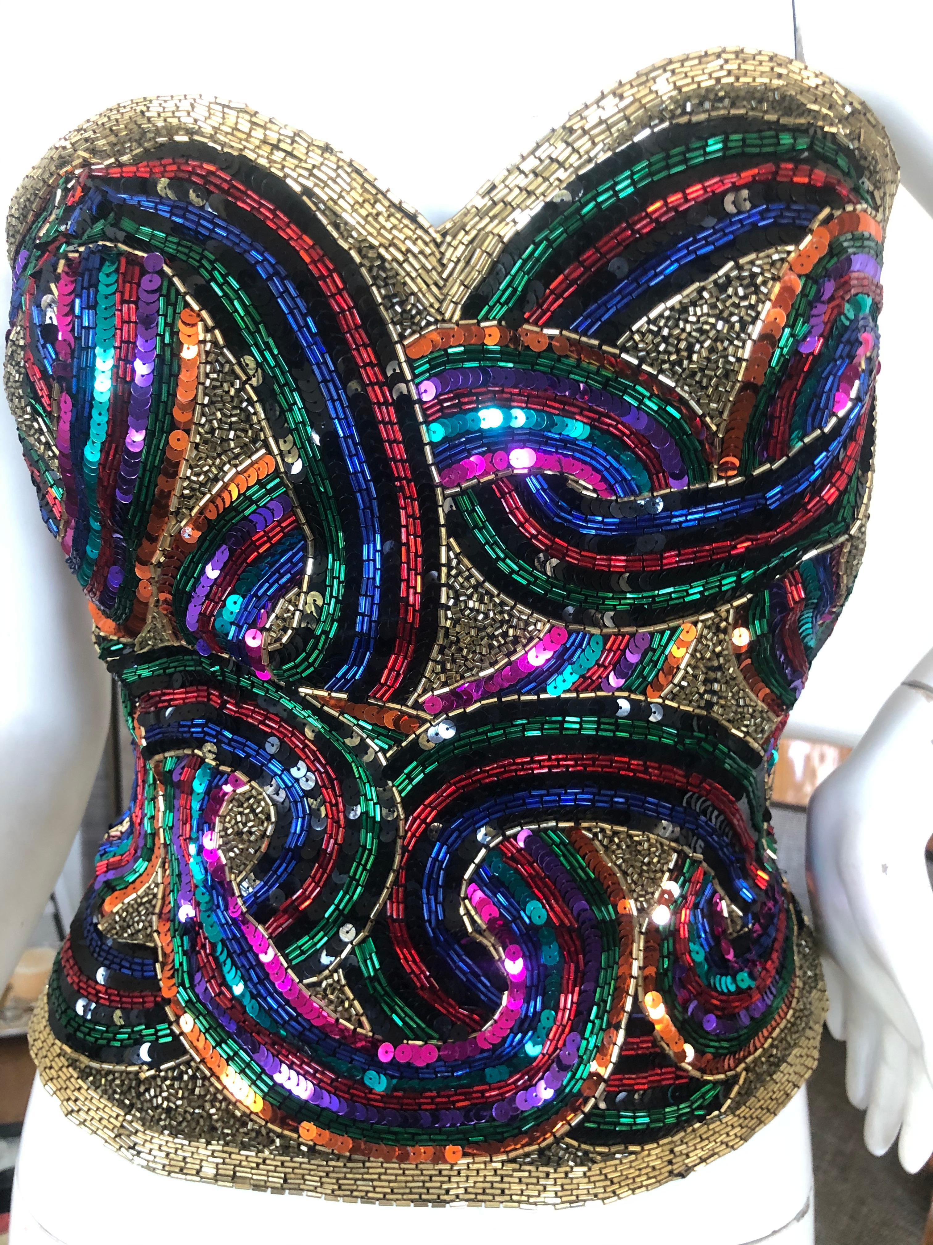 Oleg Cassini Seventies Disco Era Beaded & Sequined Corset Bustier
DIsco era divine, so much prettier in person.
Made of bugle beads and sequins that give so much movement, so fun.
Size M
Bust 32