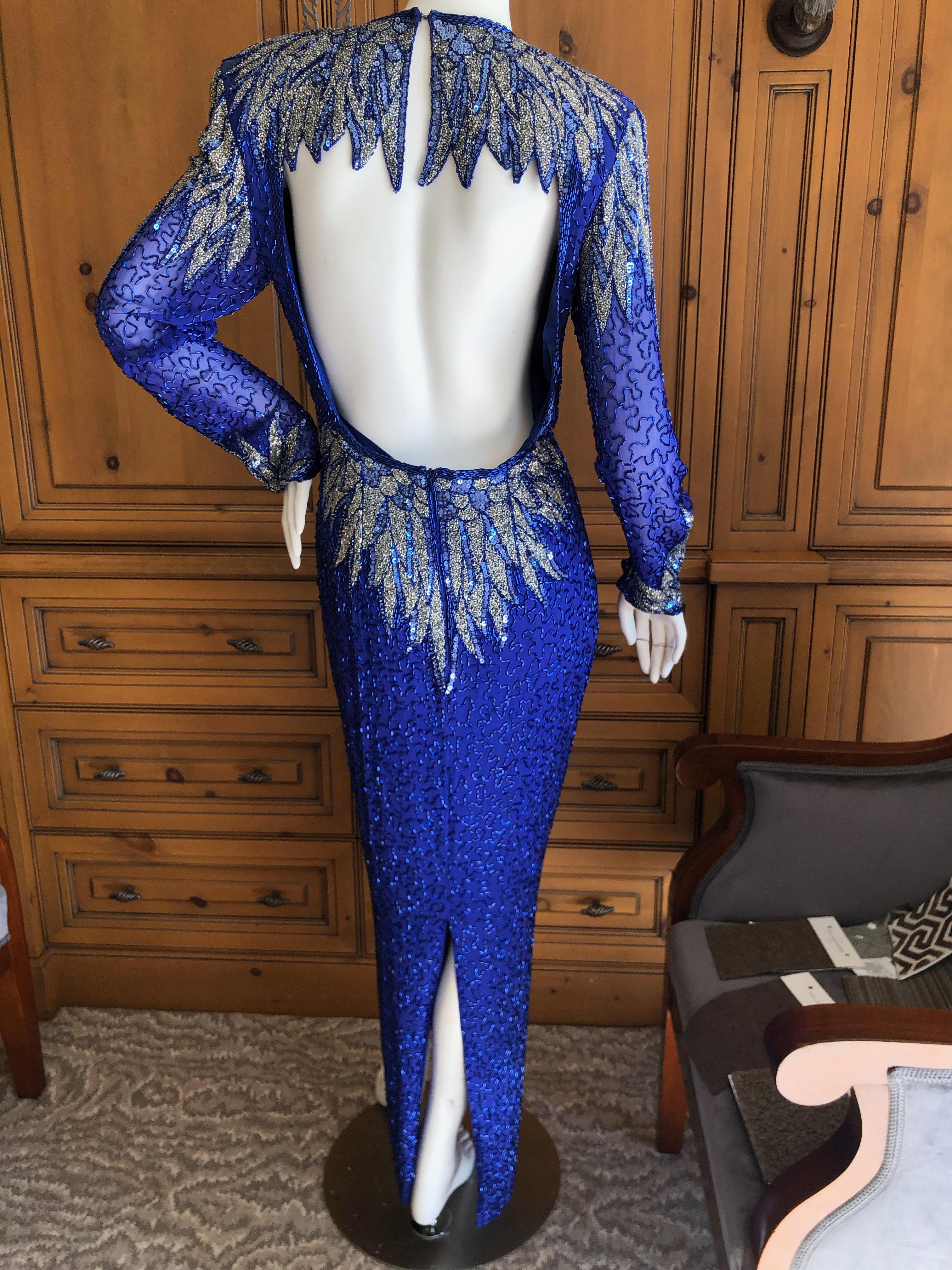 Oleg Cassini Seventies Sequin Beaded Backless Evening Dress.
DIsco era divine, so much prettier in person.
Made in Hong Kong back in the seventies,by He-Ro , this is all glass beading and is  comparable to a Bob Mackie from the same era.
Size 8, but