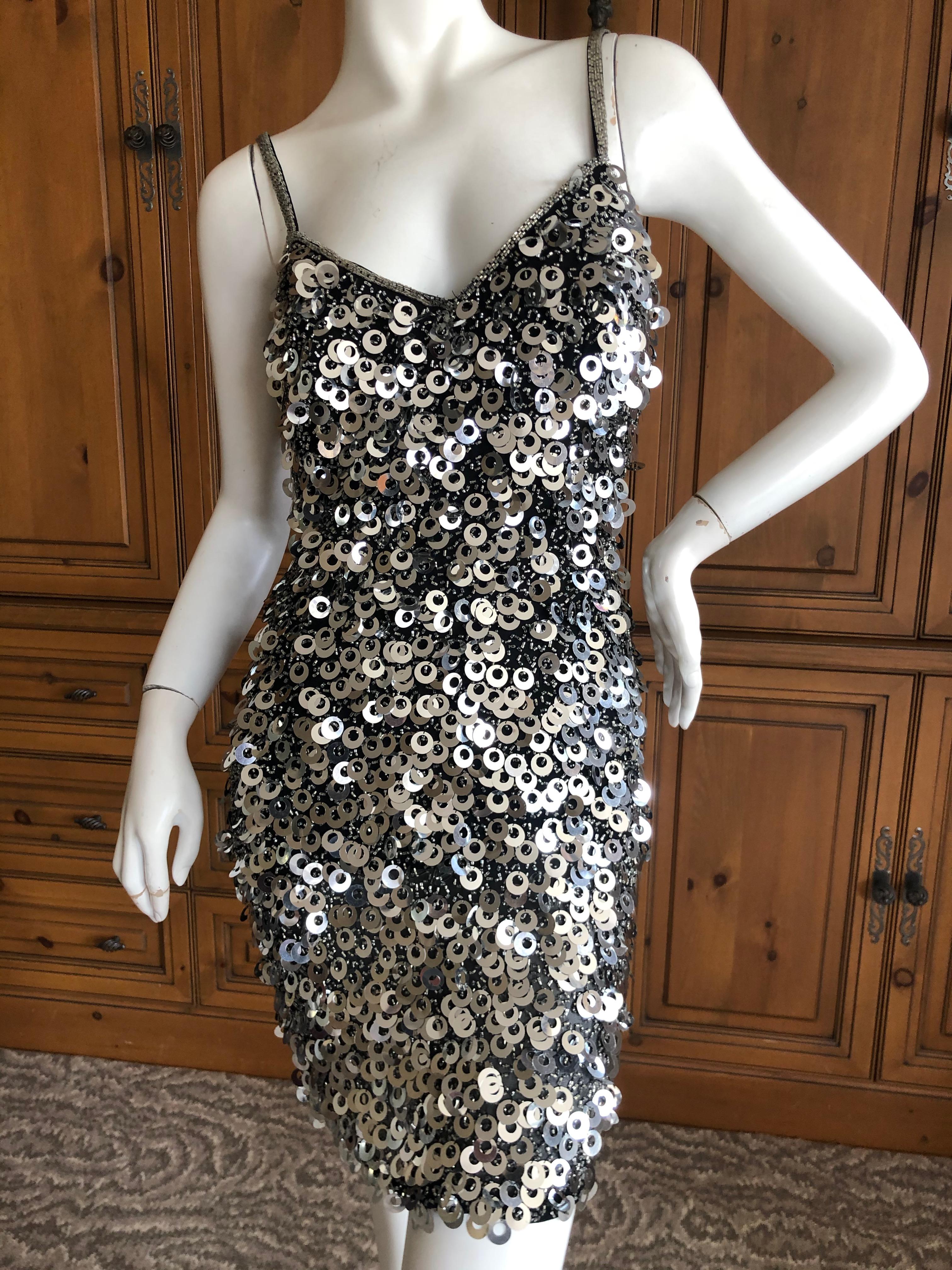 Oleg Cassini Seventies Sequin Beaded Backless Evening Dress.
DIsco era divine, so much prettier in person.
Made of seed beads and large disc like paillettes that give so much movement,so fun.
Size 4
Bust 36