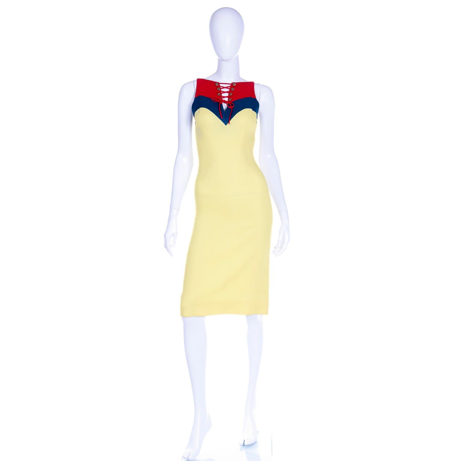 This is a fabulous vintage Oleg Cassini sleeveless linen sheath dress in yellow with a red and green corset tied bodice. We fell in love with this dress because it is such a great summer day dress and it has so many great details. We love the