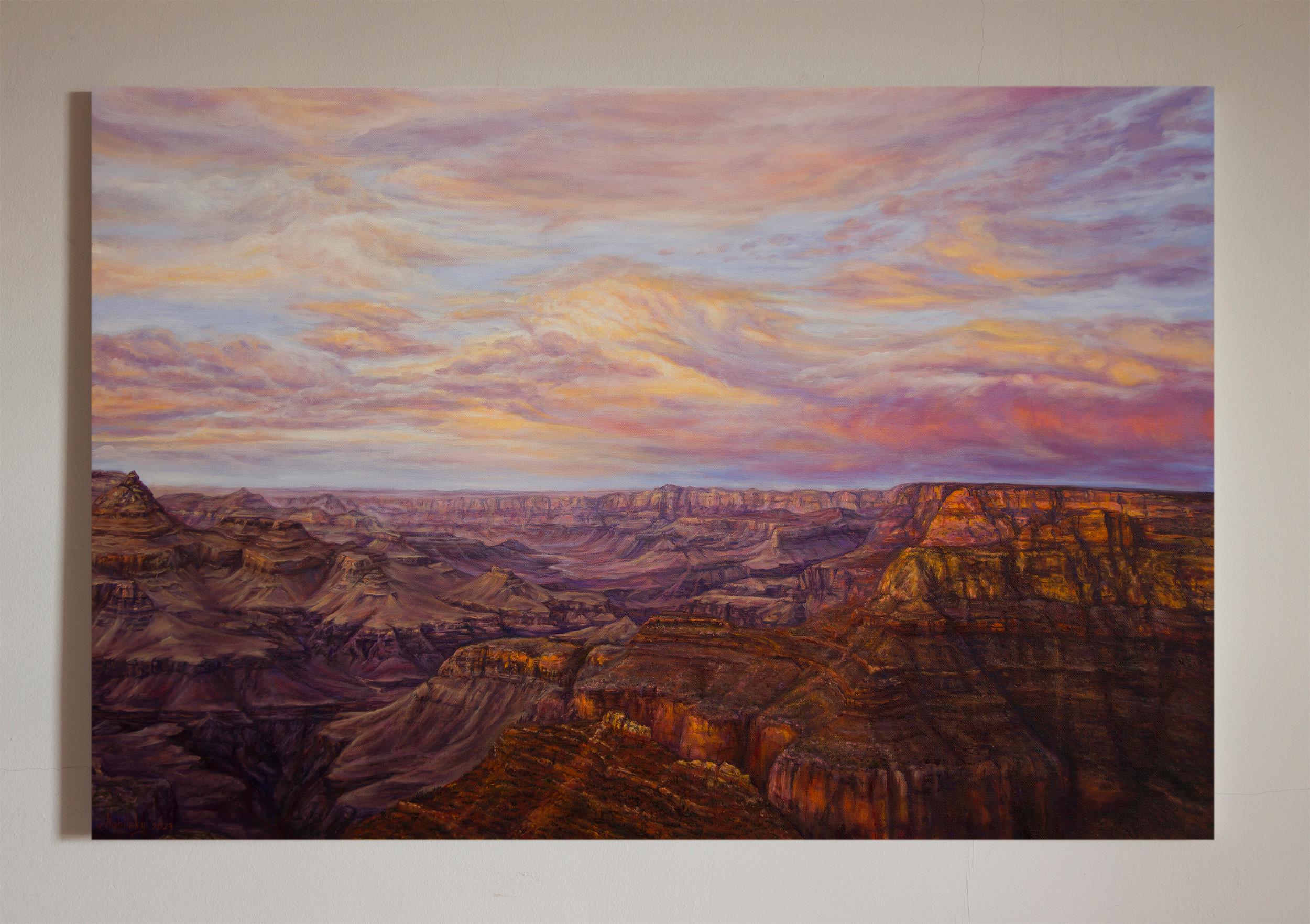<p>Artist Comments<br>Sunset reveals the vast grandeur of the Grand Canyon. The rugged cliffs glow with deep amber and violet hues beneath a sky brushed with luminous pastel clouds. It is a breathtaking interplay of light and shadow, evoking a sense