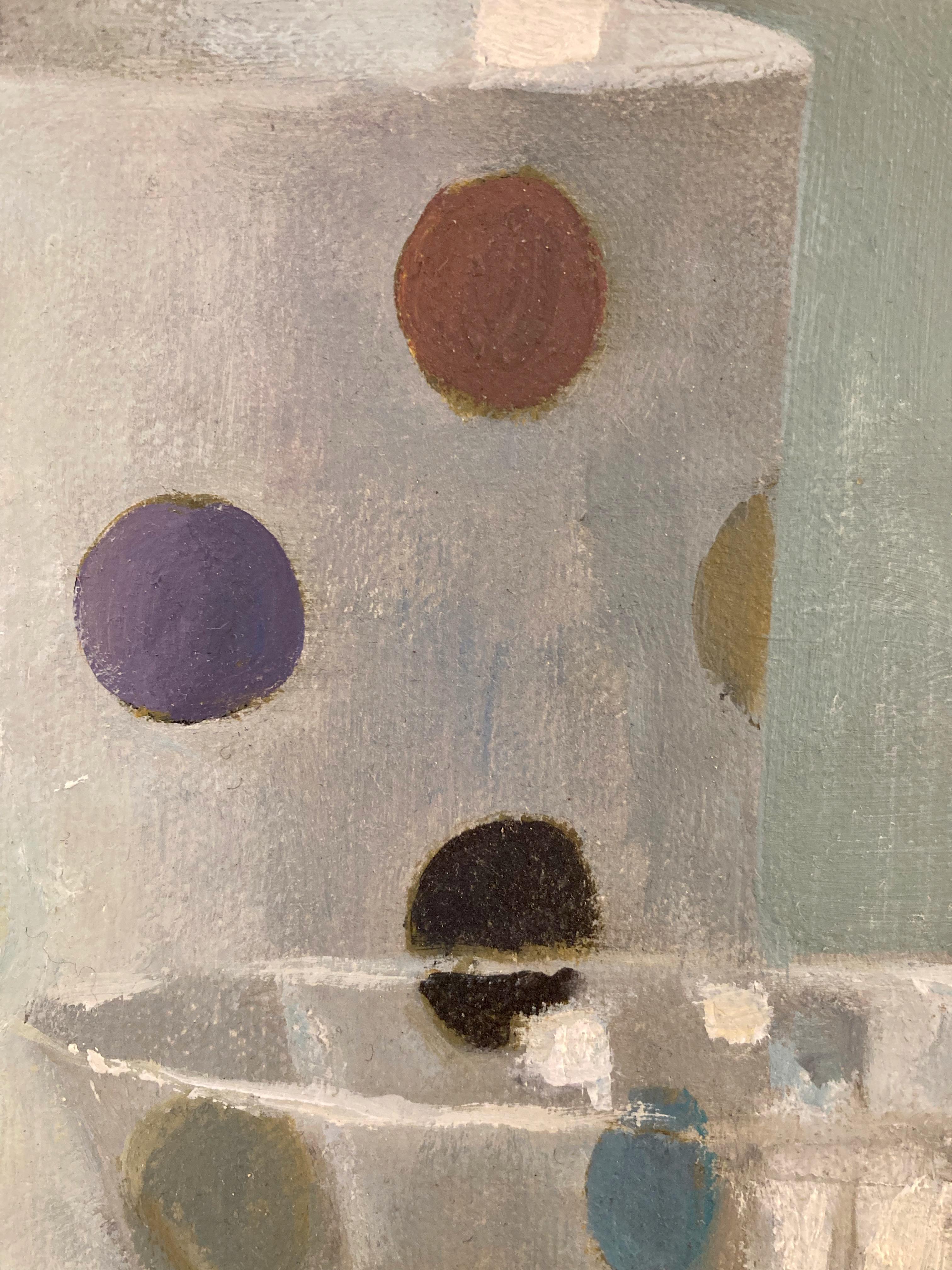 Very elegant, beautiful, whimsical and sparkly still life of white mug with yellow, blue, rust, lavender and black polka dots, a silver Russian tea glass, and lemons on a green/gray ground.   Antonova's gift for evoking reflections and shimmery