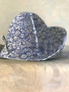 "Elegant Still Life of Two Blue and White Hats with Red Flower"