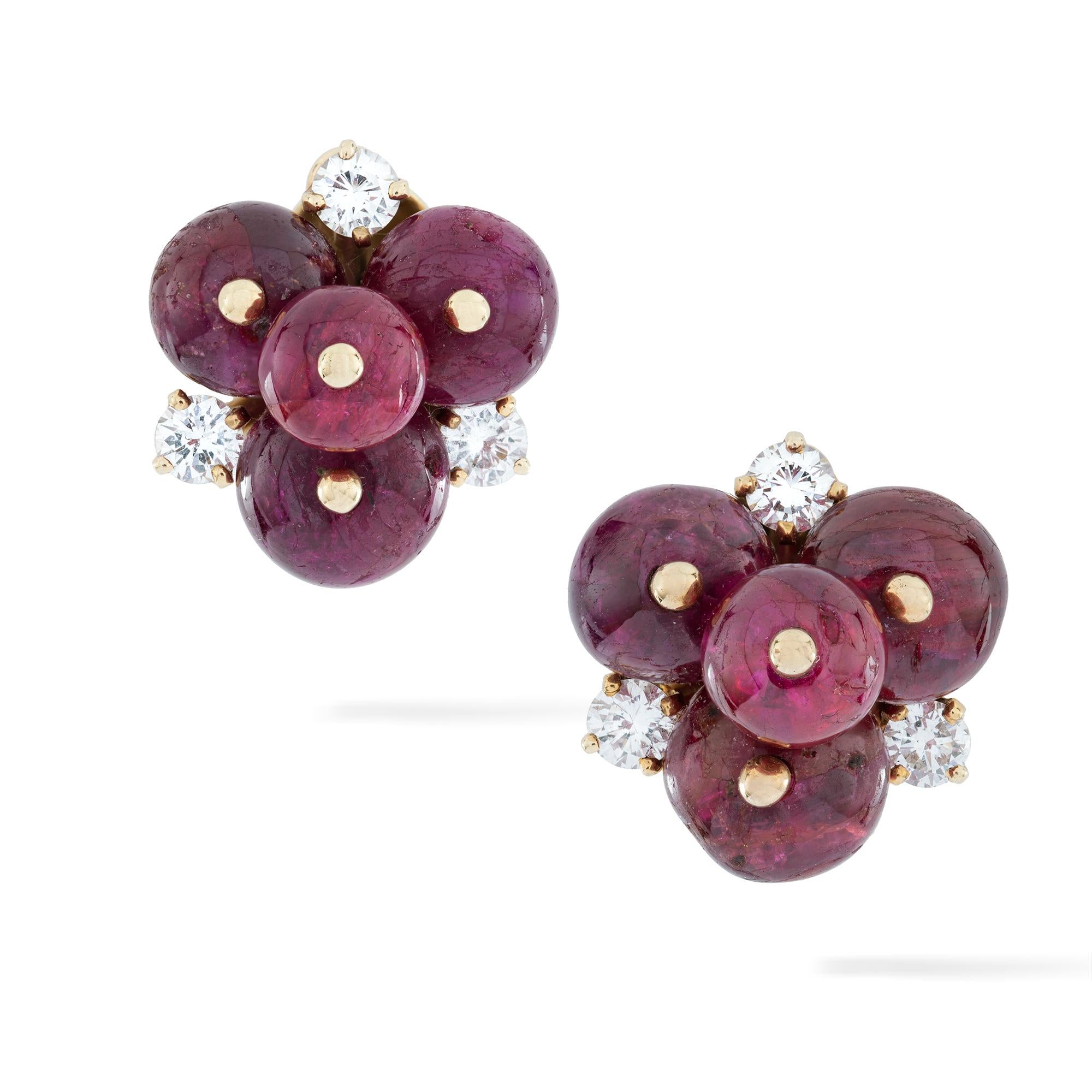 A pair of Olga Tritt of ruby and diamond clip earrings, each earring comprising of four polished ruby beads arranged in a trefoil design with three round brilliant-cut diamonds, estimated to weigh a total of 0.9 carats, as a surround, all to a gold