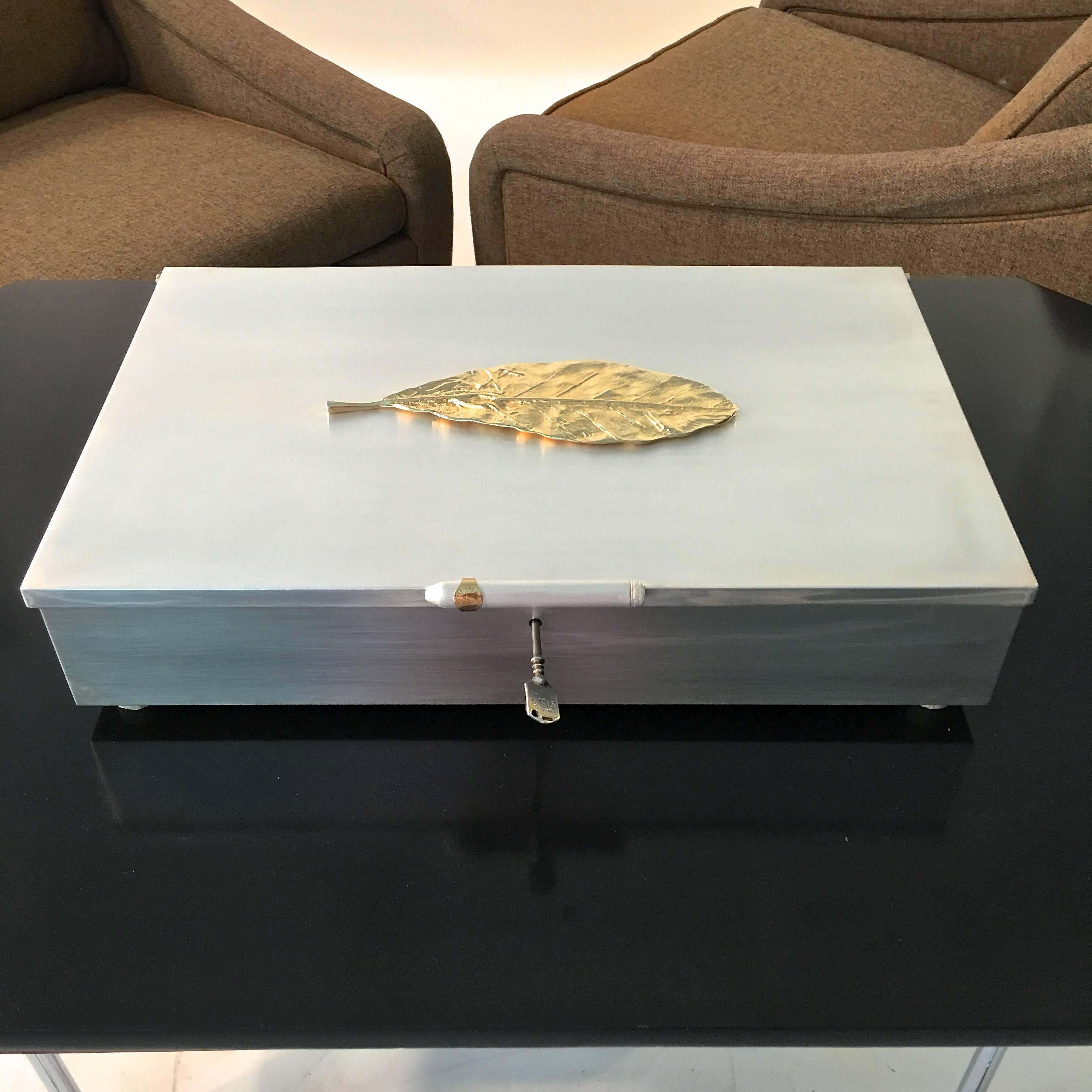 Extra large sterling silver cigar humidor prototype custom-made by a renowned gunsmith. Measures: 18 inches wide by 12 inches deep by 4 inches high on four bone feet. Sterling silver on all six sides of the lidded hinged box, even the