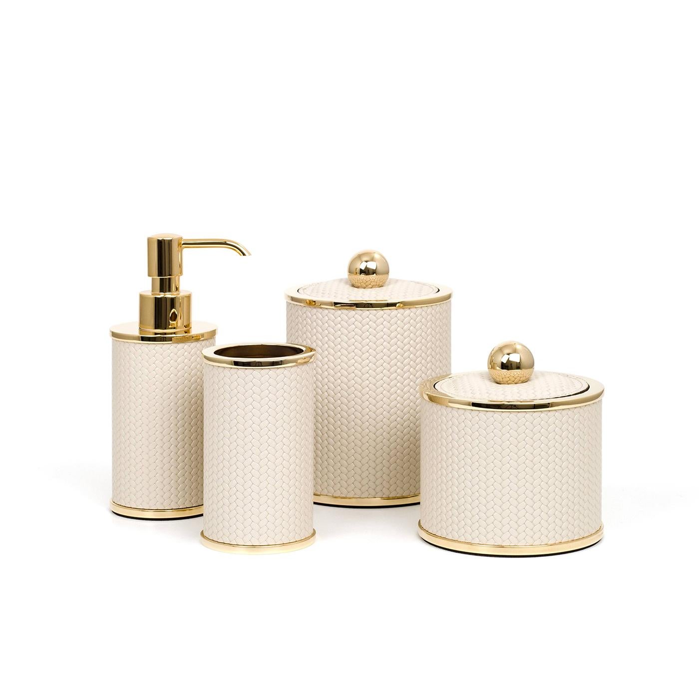 Crafted of brass and enriched with a polished golden finish of timeless refinement, this bathroom set is comprised of a toothbrush holder, soap dispenser, and box for cotton pads equipped with a lid, all placed on a coordinated tray. A prized