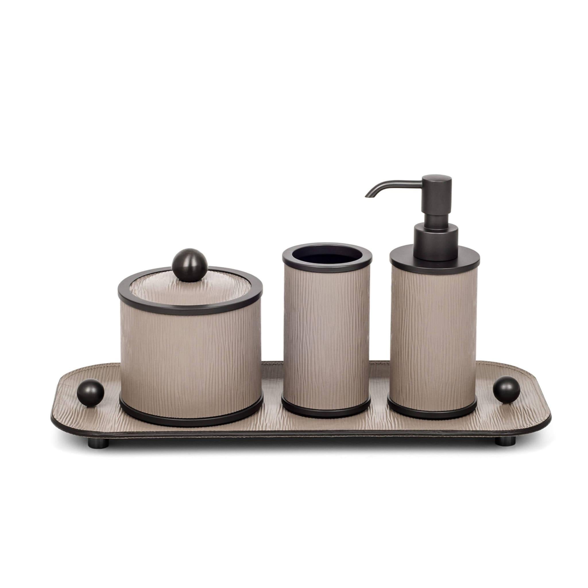 Comprising all cylindrical items resting on an elegant, coordinated tray, this luxe bathroom set consists of a soap dispenser, toothbrush holder, and two boxes with lids: one for cotton pads, and another one for beauty essentials. The pieces'