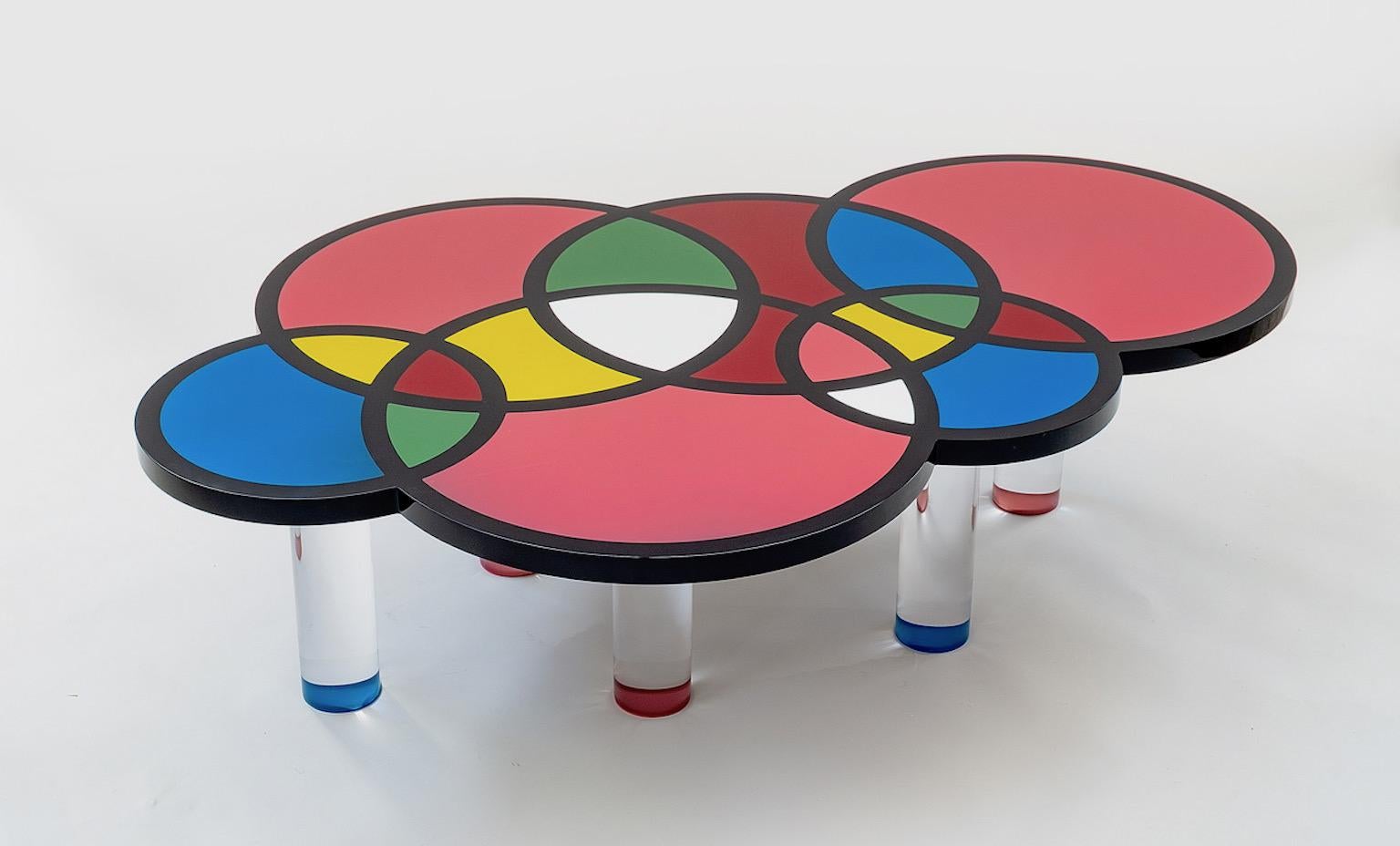 Coffee table Olimpia model in plexiglas with base in various colors and with 6 cylindrical legs in plexiglas.
Designed by Studio Superego for Superego Editions.

Superego Editions was born in 2006, performing a constant activity of research in