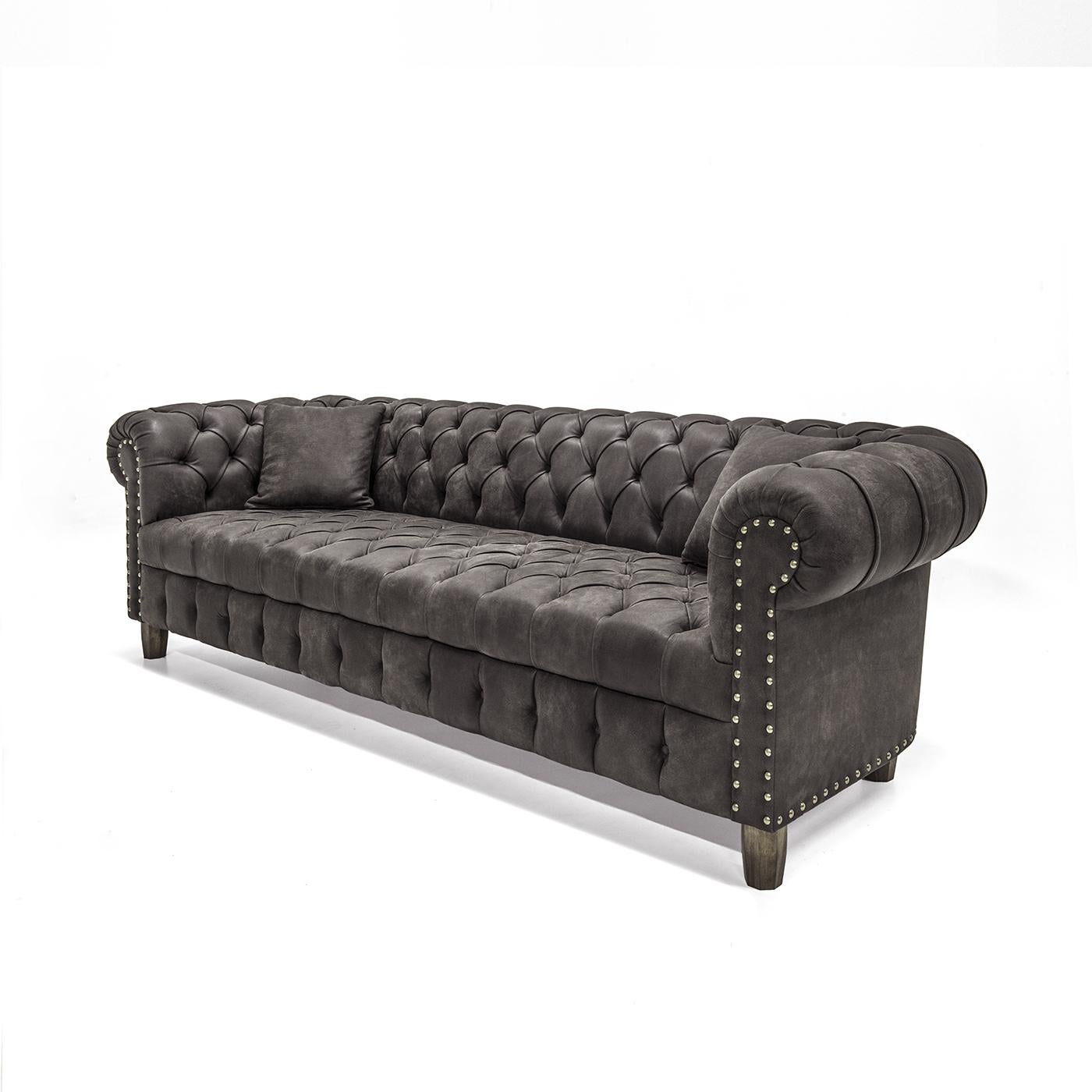 This sofa will make a sophisticated statement in any home and will instantly enhance a classic decor. This piece was crafted by hand with a structure in solid wood and seat padding complete with internal Greek springs. Fine leather upholstery,