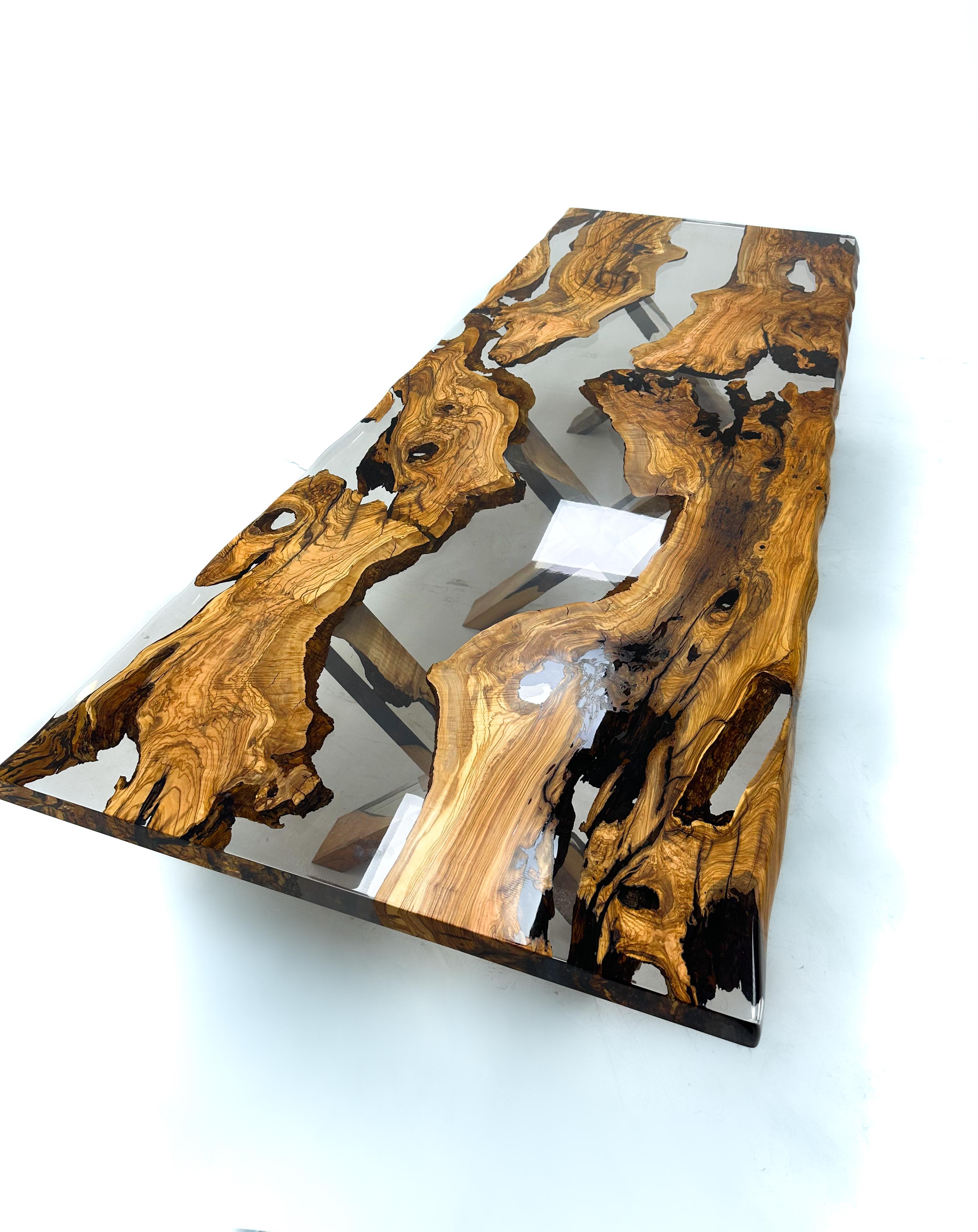 Custom Olive Epoxy Resin Dining Table

This stunning table is made of Mediterranean Olive wood. The unique beauty of the natural curves of olive wood combined with black epoxy is seen in this table.

All woods have its own natural shape. Therefore,