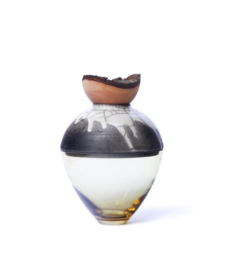 Olive and grey butterfly stacking vessel, Pia Wüstenberg
Dimensions: D 20 x H 24
Materials: glass, wood, ceramic
Available in other colors.

A delicate piece with a mind of its own: beautiful patterns emerge from the glaze and the fire, making