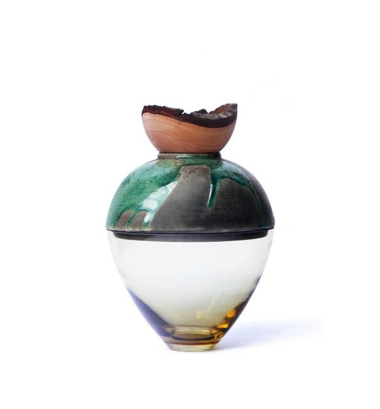 Olive and Turquoise Butterfly stacking vessel, Pia Wüstenberg
Dimensions: D 20 x H 24
Materials: glass, wood, ceramic
Available in other colors.

A delicate piece with a mind of its own: beautiful patterns emerge from the glaze and the fire,