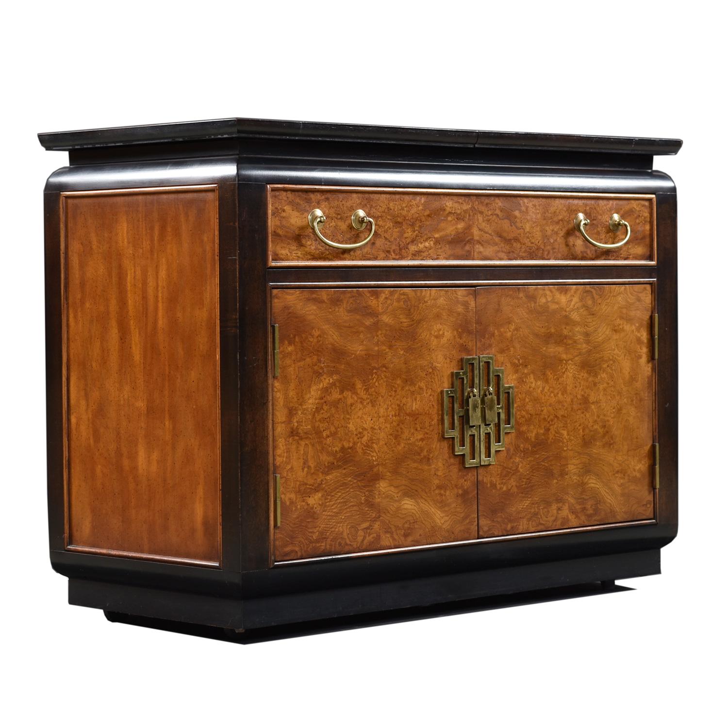 Dorothy Draper style campaign server bar cart on casters made by esteemed US furniture maker Century circa 1970s. Old growth flaxen flared grain olive burl from top to bottom, front and back. Beautifully finished on all four sides. Black lacquer