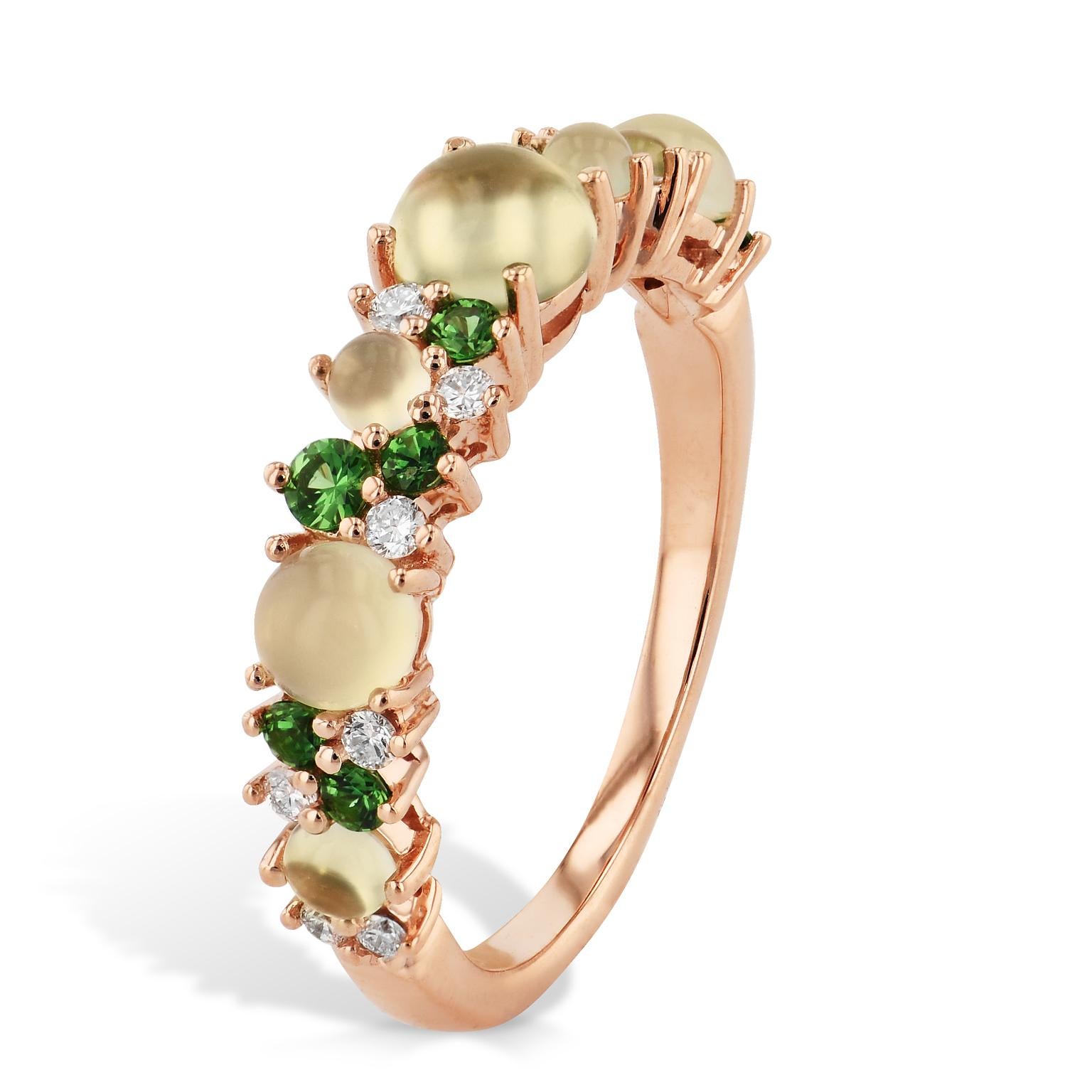 Break out of the ordinary in your style with this eye catching display of cabochon cut olive chalcedony, diamonds, and prehnite stones all held in a 18 karat rose gold band.