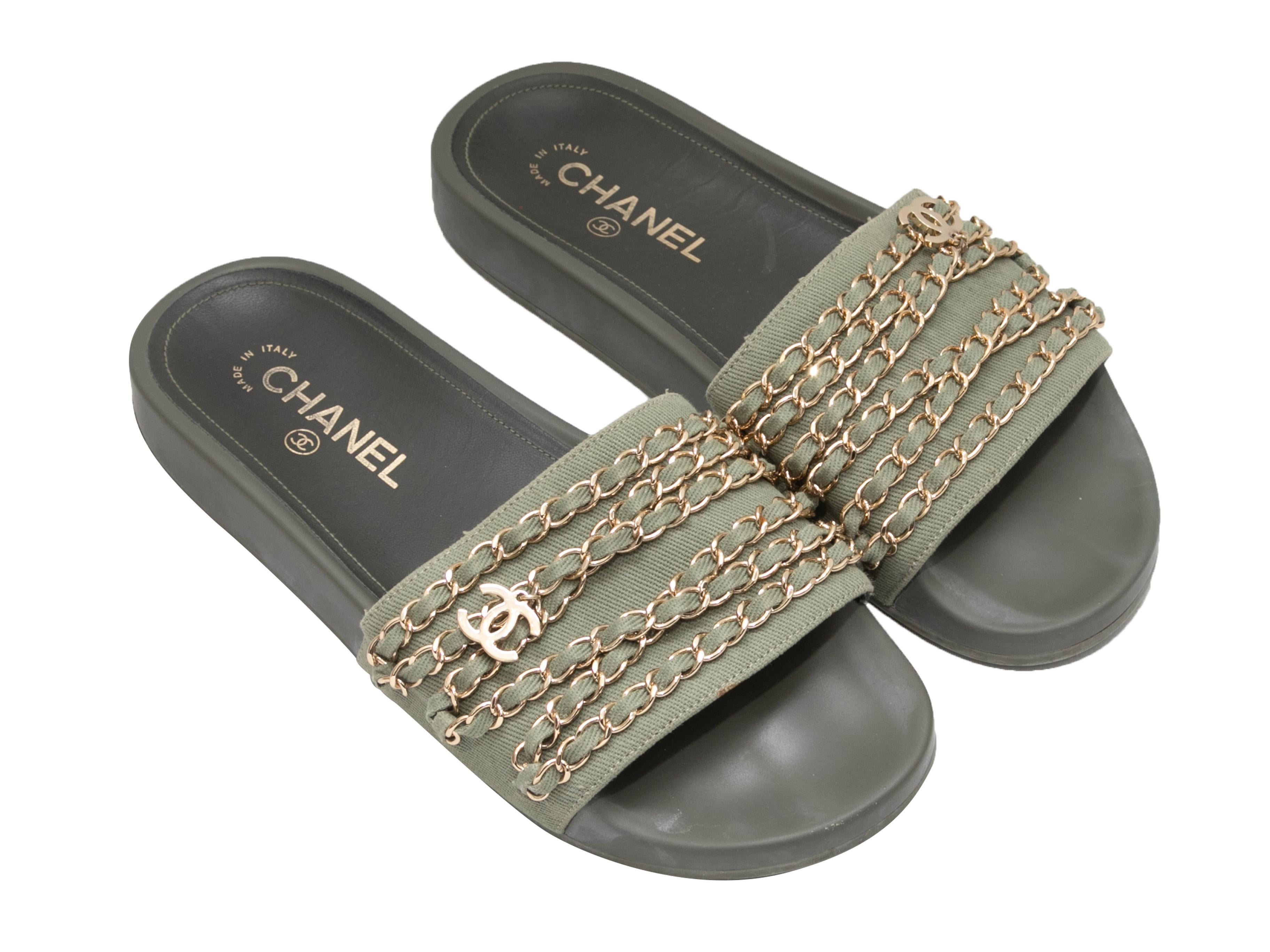 Olive canvas chain-accented slide sandals by Chanel. Rubber soles. 1