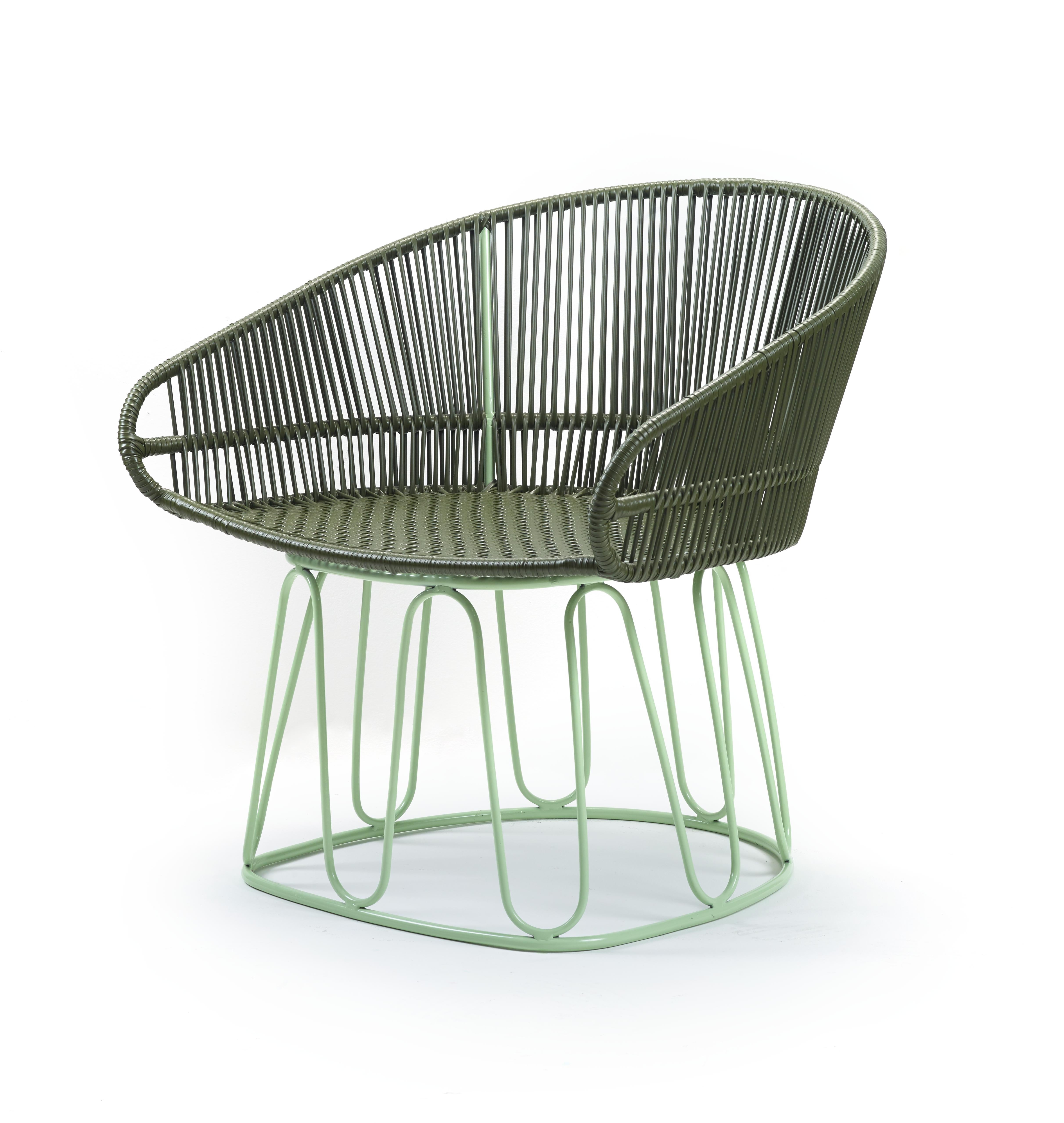 Olive circo lounge chair by Sebastian Herkner
Materials: Galvanized and powder-coated tubular steel. PVC strings.
Technique: Made from recycled plastic. Weaved by local craftspeople in Colombia. 
Dimensions: W 74 x D 66.2 x H 73 cm 
Available in