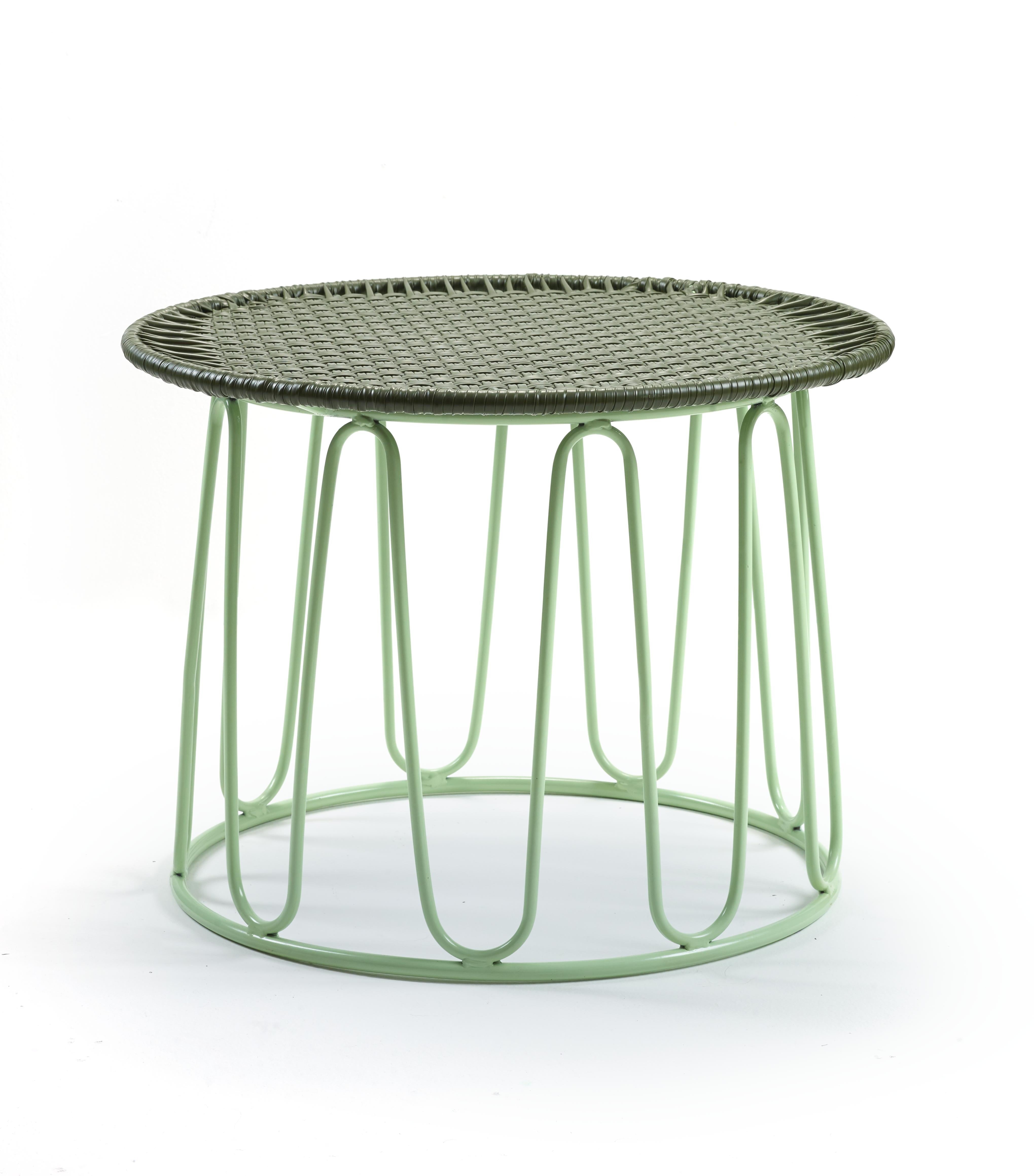 Olive circo side table by Sebastian Herkner.
Materials: Galvanized and powder-coated tubular steel. PVC strings.
Technique: Made from recycled plastic. Weaved by local craftspeople in Colombia. 
Dimensions: 
Top diameter 55 cm 
Base diameter 51