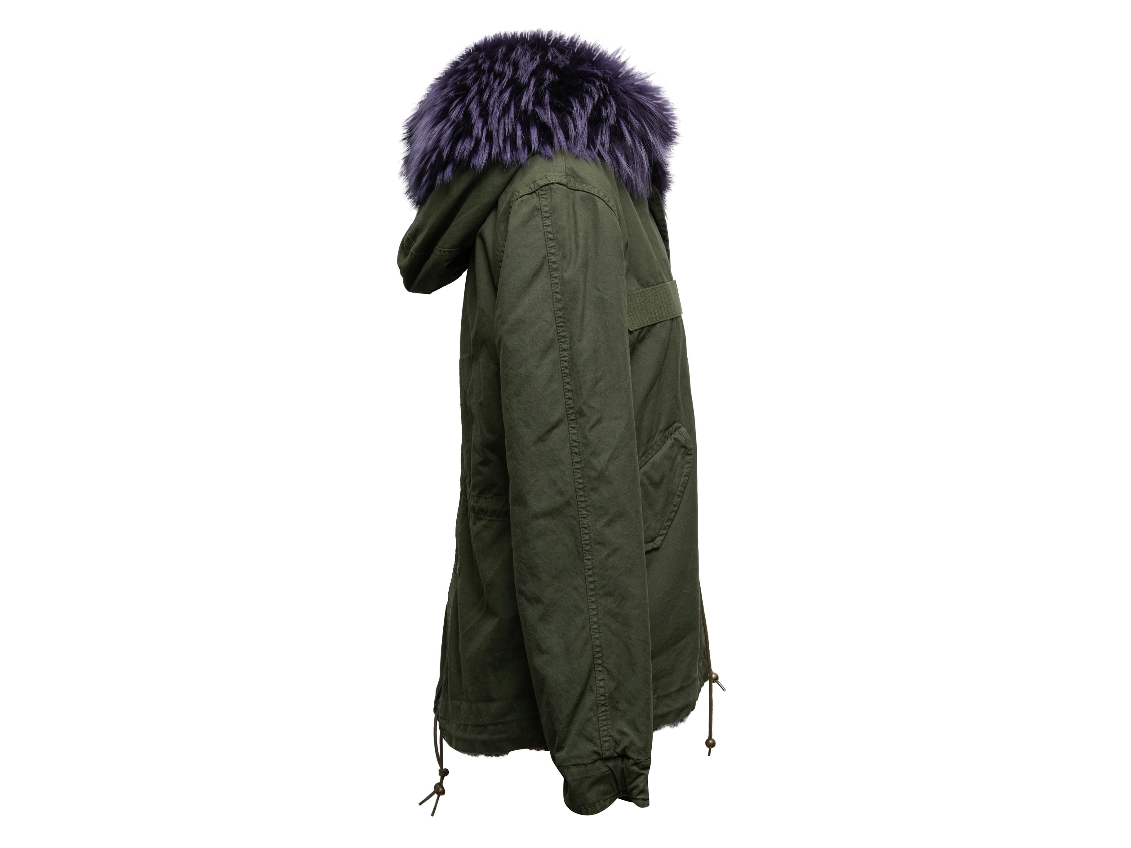 Olive and dark purple fur-trimmed hooded parka by Mr & Mrs Italy. Dual hip pockets. Drawstring at waist. Zip front closure. 34