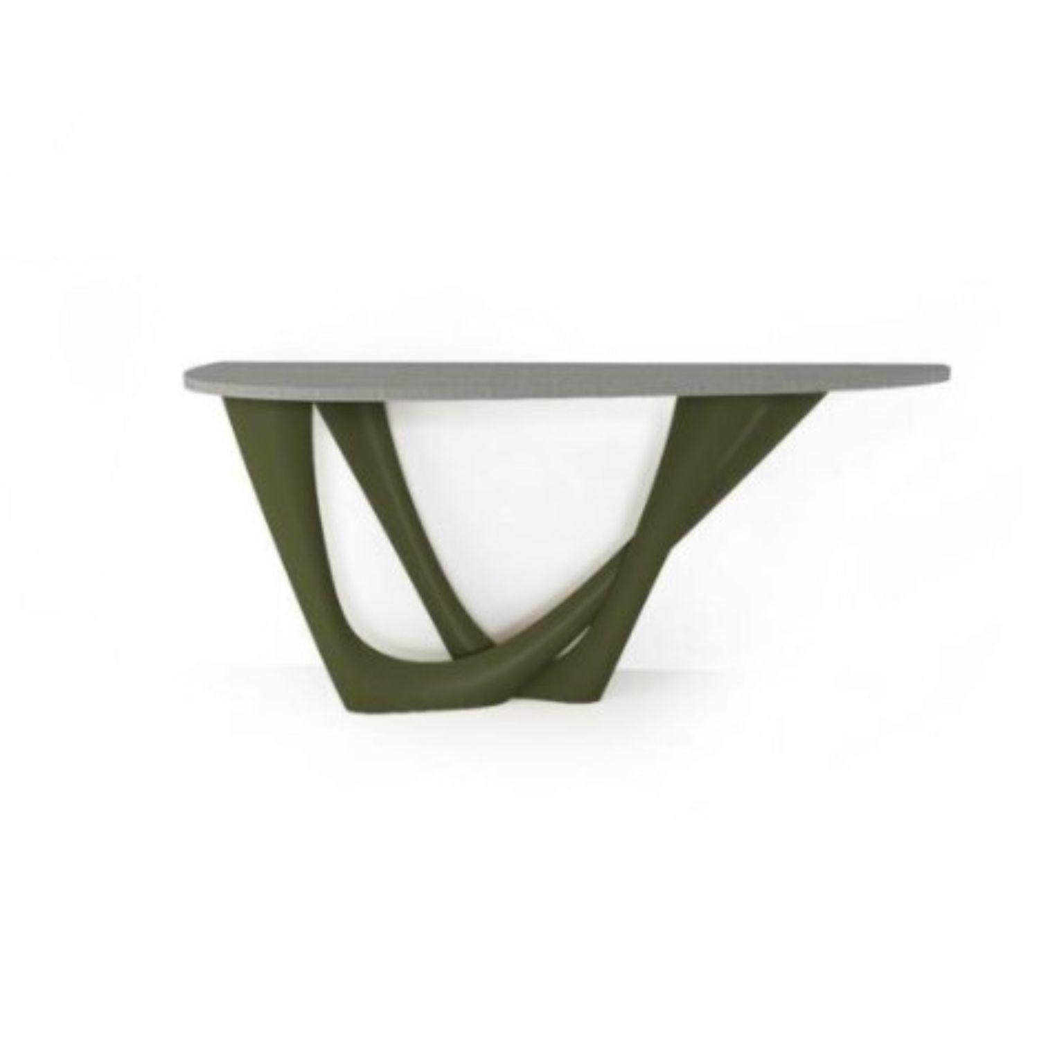 Olive Green G-Console Duo concrete top and steel base by Zieta
Dimensions: D 56 x W 168 x H 75 cm 
Material: Carbon steel, concrete.
Also available in different colors and dimensions.

G-Console is another bionic object in our collection. Created