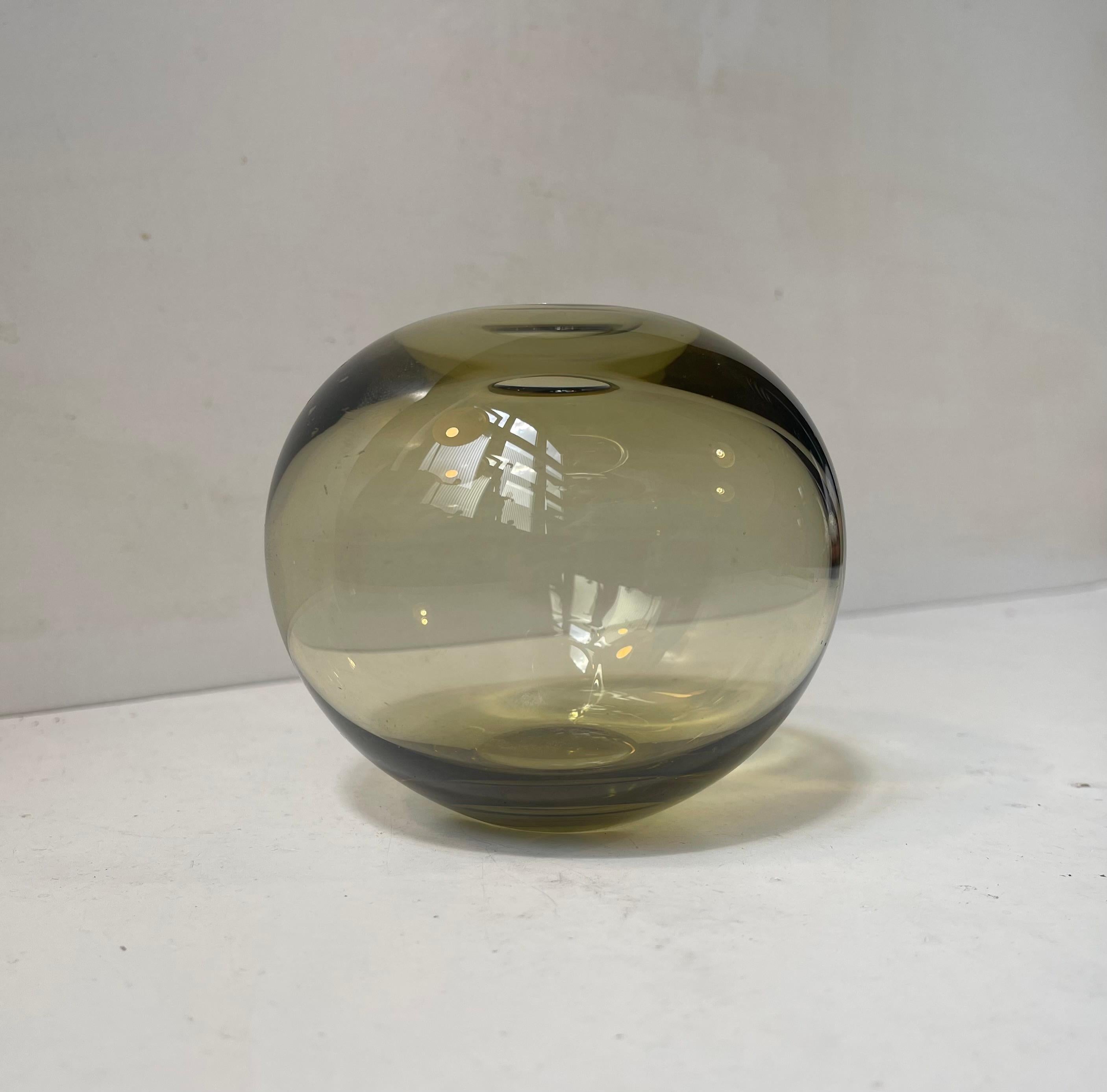 In the series 'Olive Disko' this rare Rondo Vase by Per Lütken was made in 1959. The name Disko has nothing to do with disco. In fact the name was inspired by the reflections of light Lütken experienced visiting Diskobugten/ The Disko Bay in
