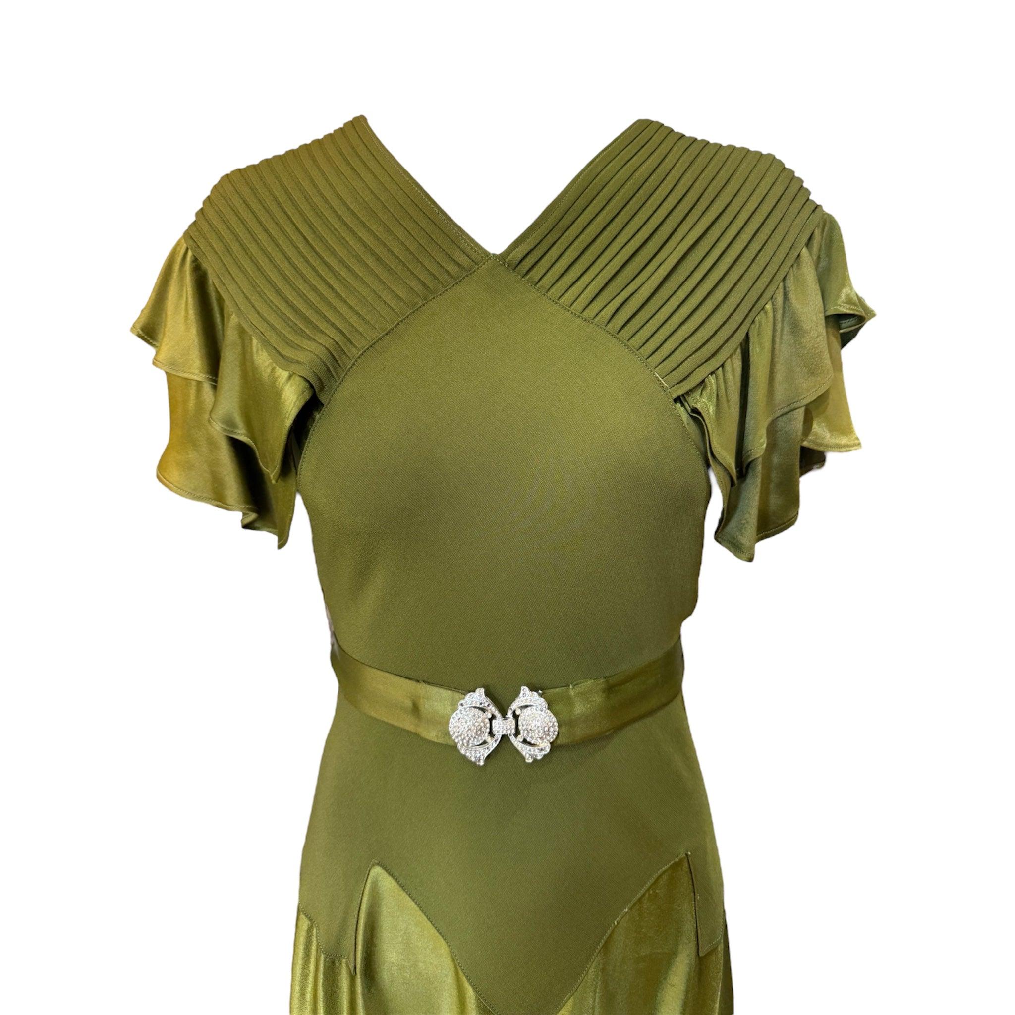 One of the best we have had and an absolutely stunning dress from the 1930's. Made of satin and crepe, cut on the bias. With ruffled flutter sleeves and finely stitched pintuck detail on the shoulders. It comes with its original matching belt with