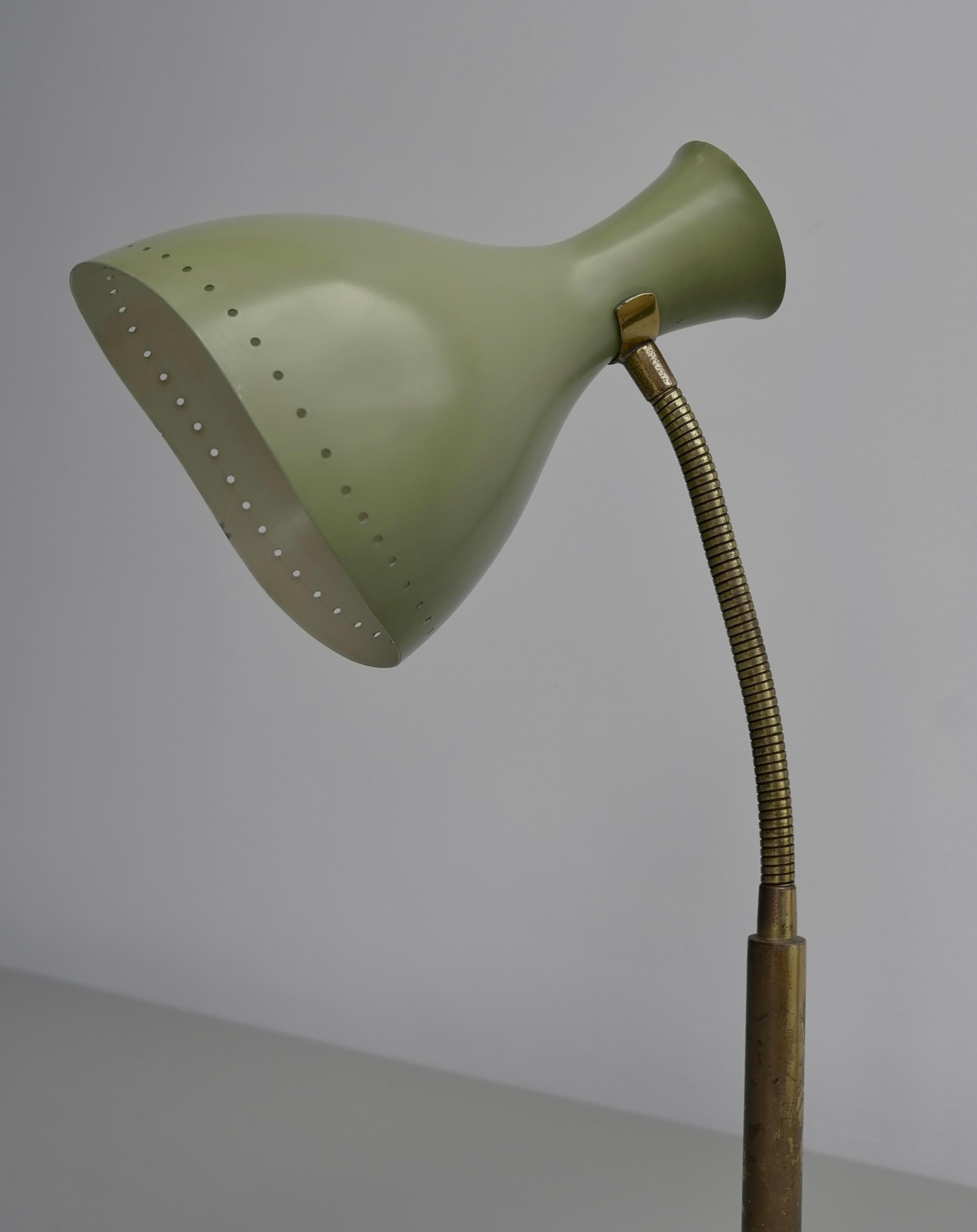 Olive green table lamp with brass details, Italy 1950's

Very well made piece with fine detail. Most probably made by Stilnovo or Stilux.