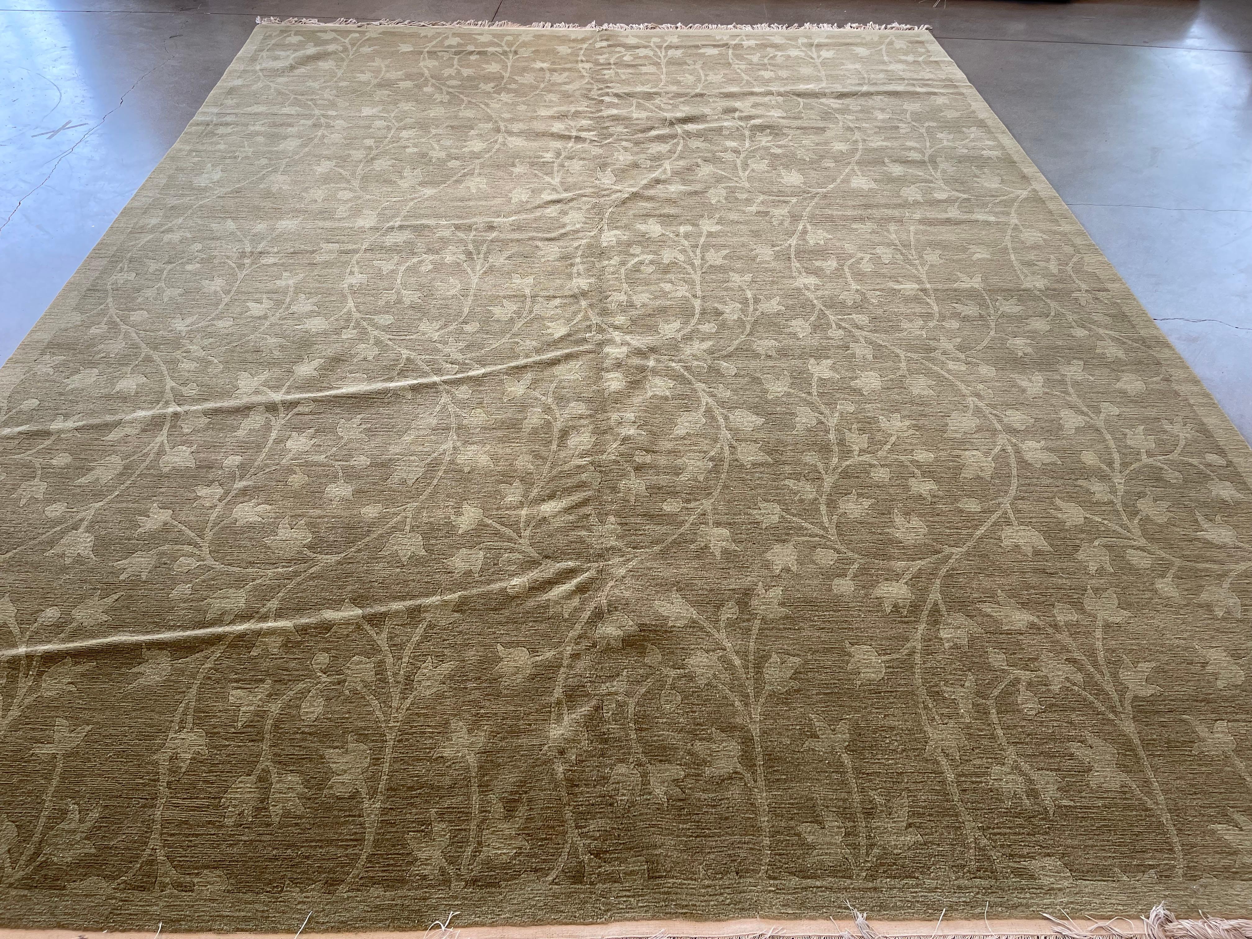 Do you love tulips? Then there is a good chance this rug will fit perfectly in your space. This olive green tulip and vines all over design is sure to liven up and add whimsy to your space. This rug is made of all wool that is not only durable but
