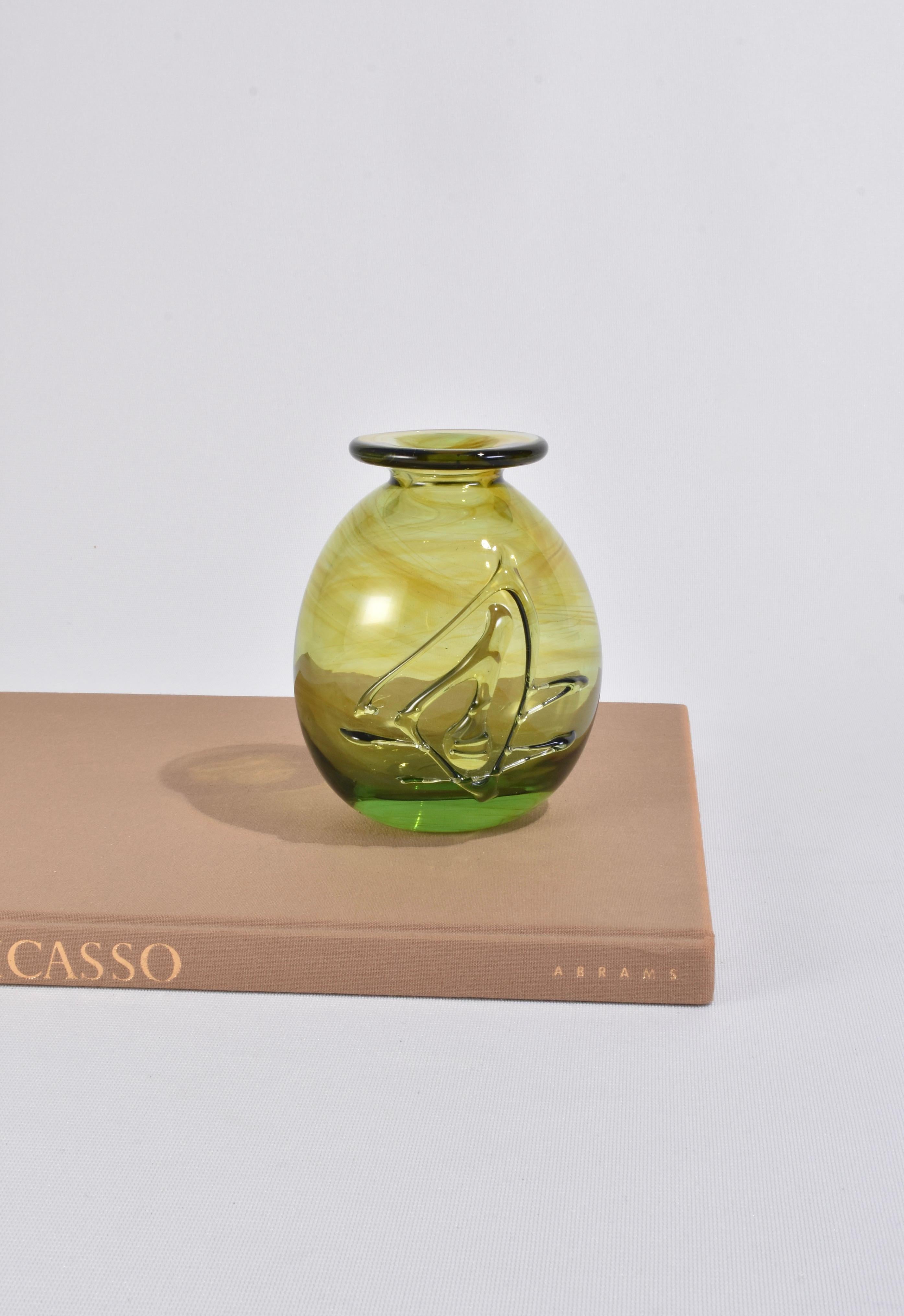 Stunning, olive green blown glass stem vase with an applied abstract design. Signed on base, William '83.