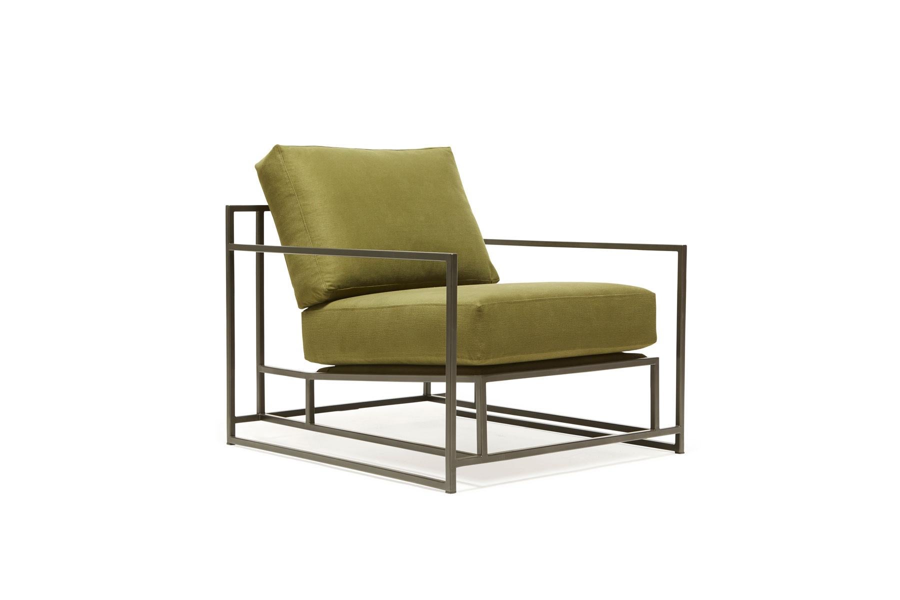 The Inheritance Armchair by Stephen Kenn is as comfortable as it is unique. The design features an exposed construction composed of three elements - a steel frame, plush upholstery, and supportive belts. The deep seating area is perfect for a