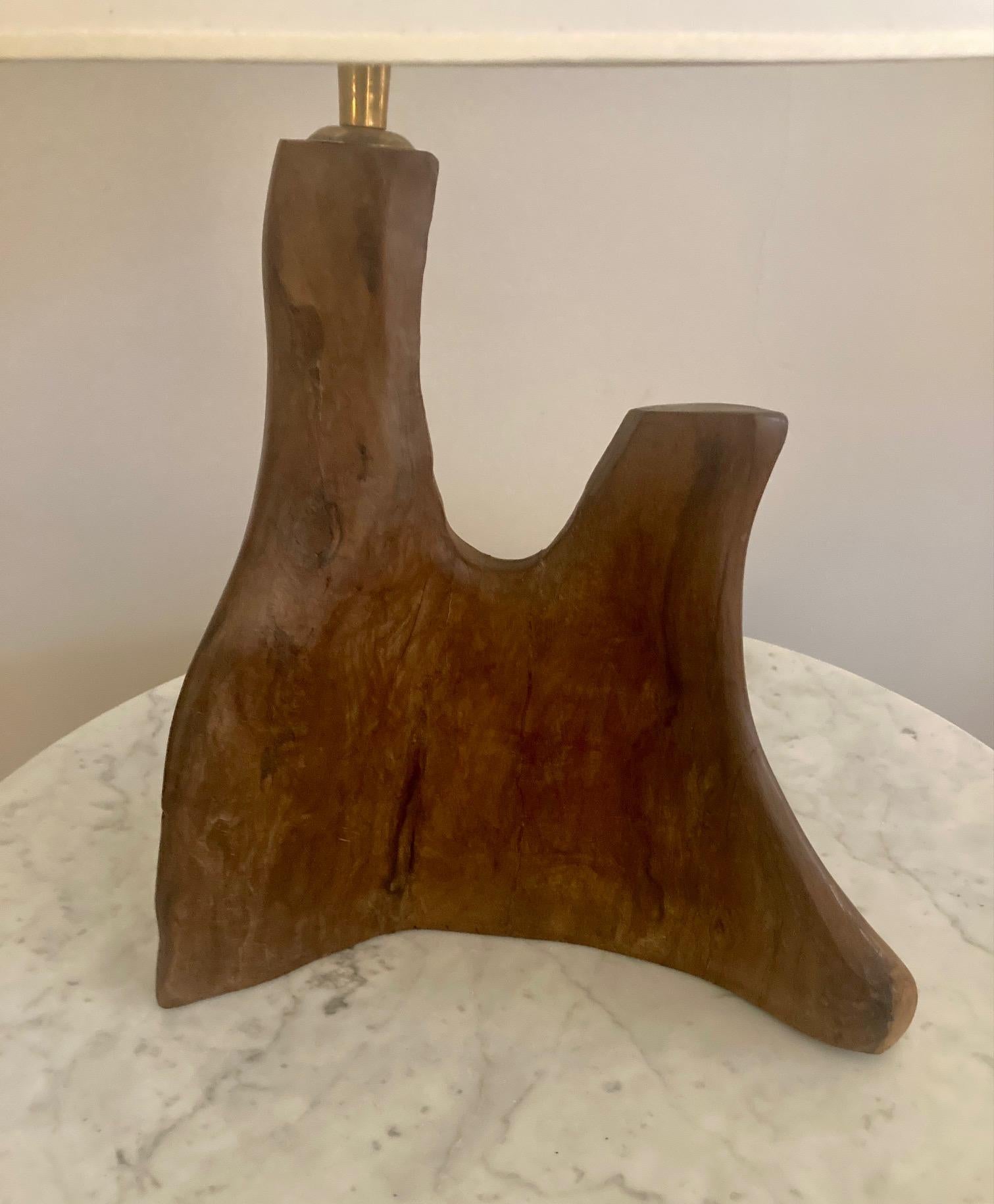 Table lamp made of sculpted olive wood.
Organic shape.
France.
1950

Dimensions : 

Height ( with the shade ) : 53 cm / 20,86 inch 
Wood height : 28 cm / 11,02 inch 
Width : 26 cm / 10,23 inch 
Depth : 5 cm / 1,96 inch.