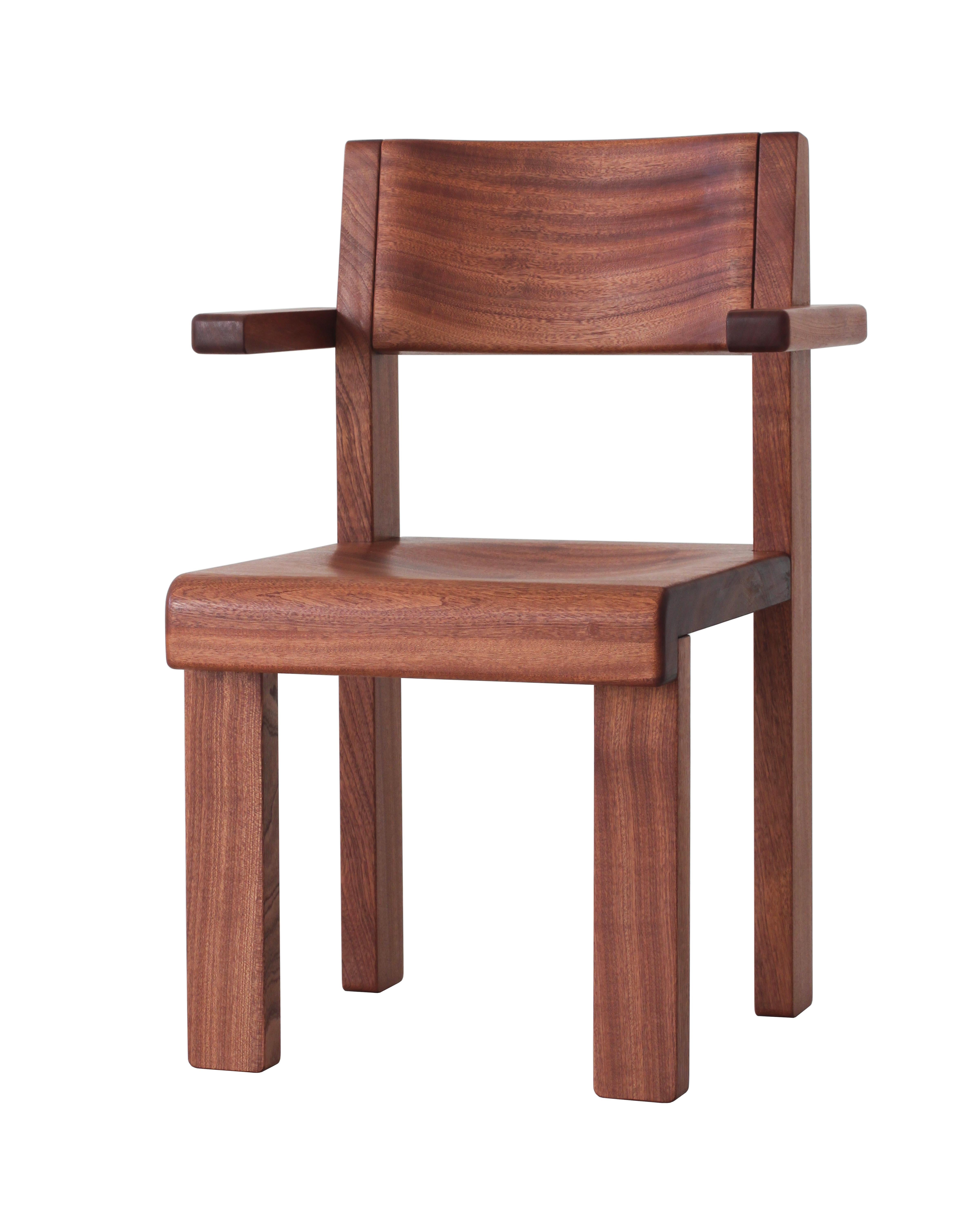 Oliver armchair is made of solid sapele wood with a hand-rubbed oil finish. The design is robust yet simple, with clean lines and soft edges. Thick legs enable sturdy connections, limiting the number of parts needed, and the front and back legs are
