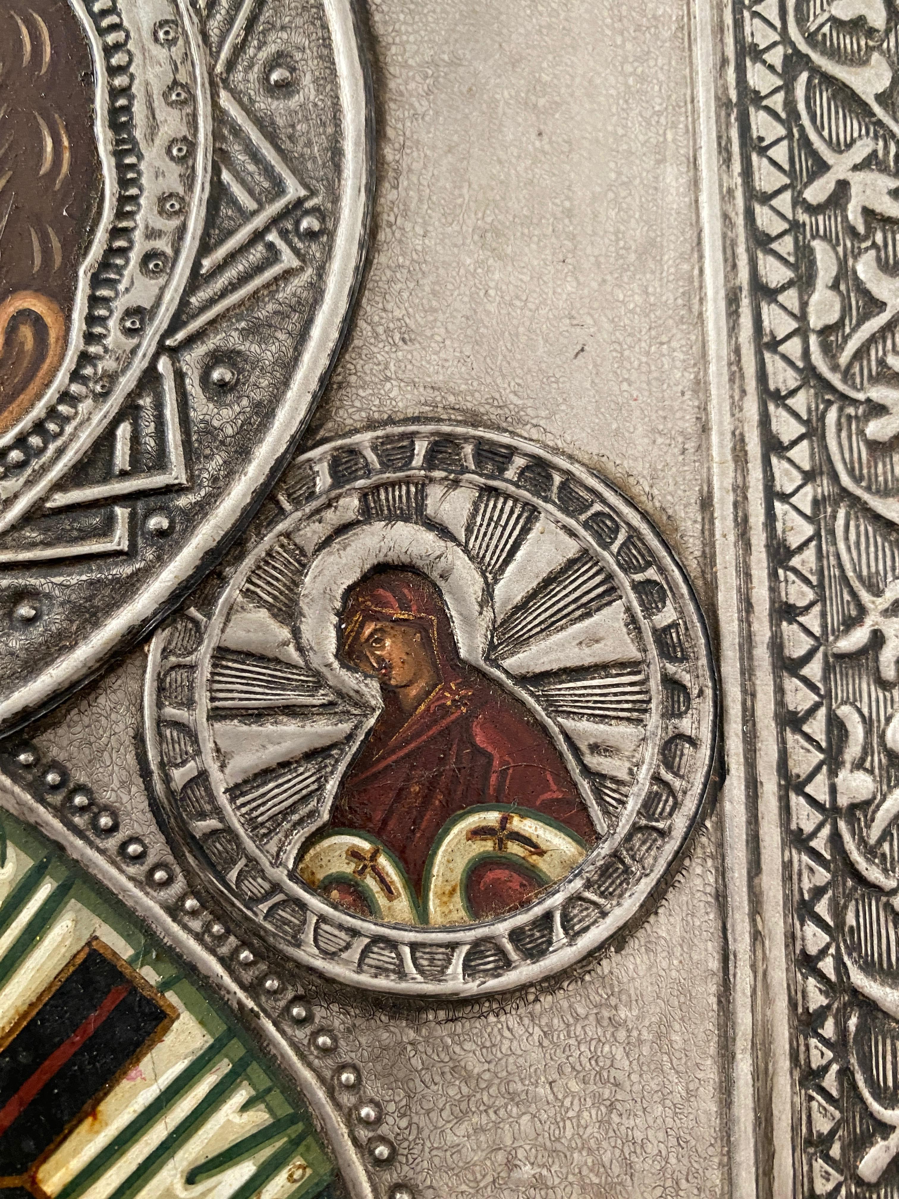 Icono of Saint Nicolas in the style of Russian icons of the 18th century. 
Egg tempera and gesso on wood, covered by a metal  oklad made by the artist himself. The oklad, in principle, were made to cover damaged parts of highly revered ancient